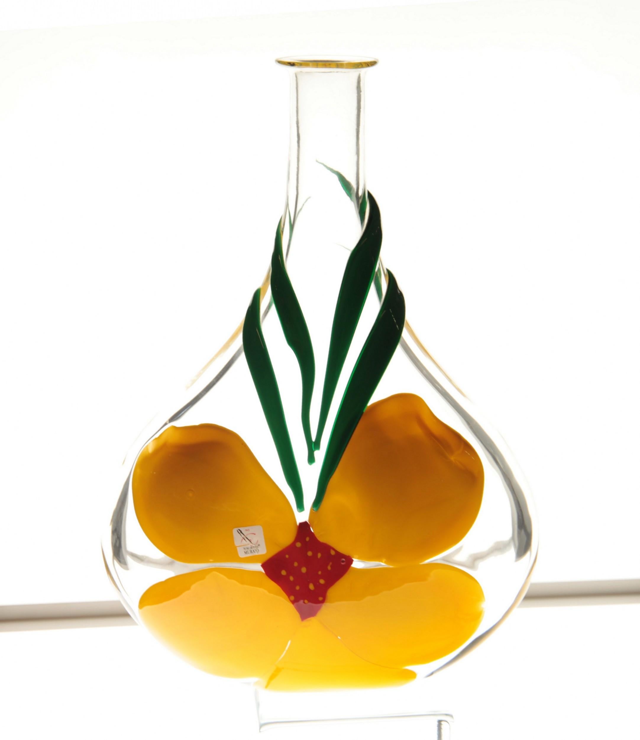 Singed Pauly vase with flask oval vase by Berit Johansson, Swedish designer who worked and works for top glass maker companies. She brings a freshness of design with her use of color and mostly flower subjects.
The design is made with pate de verre