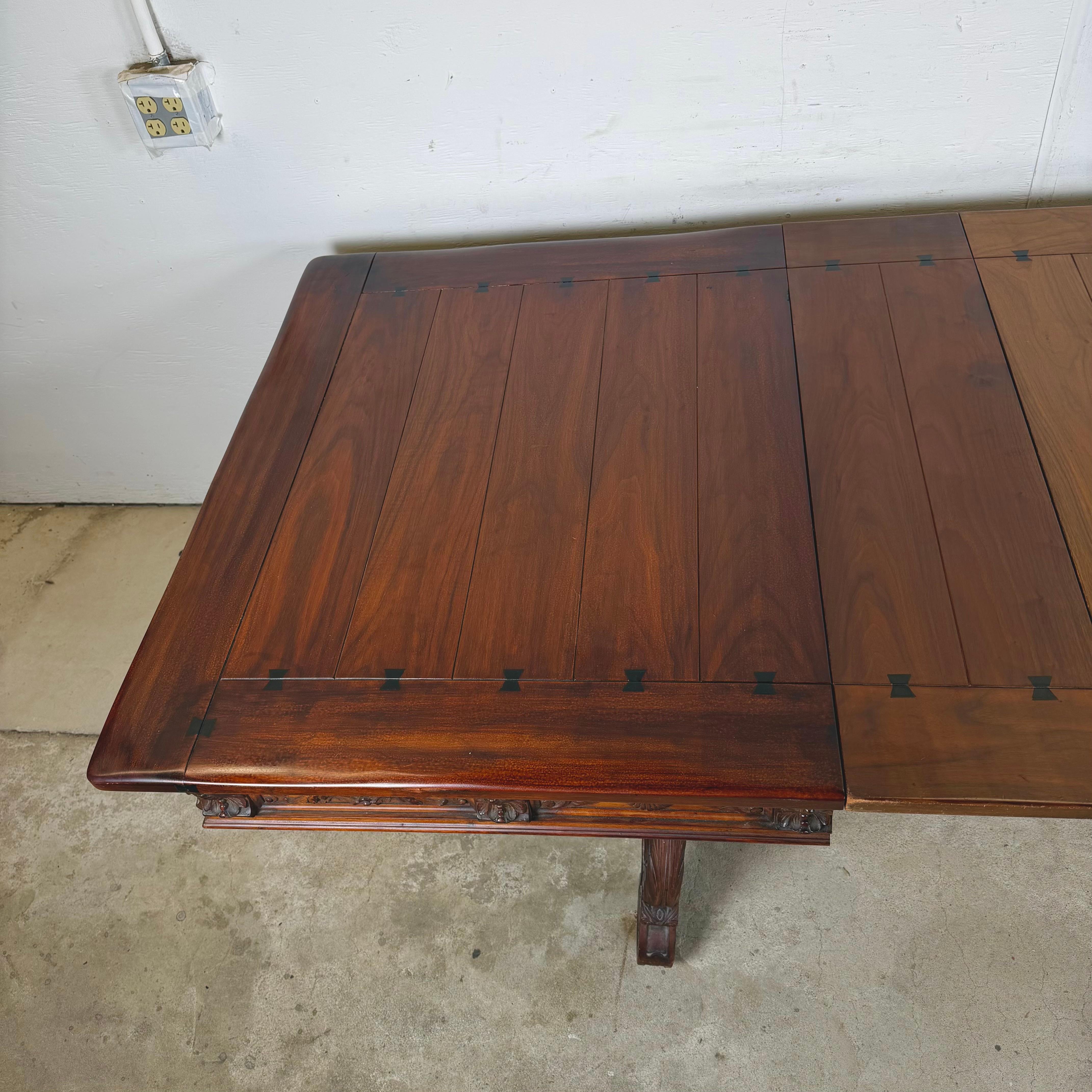 20th Century Berkey & Gay Spanish Revival Trestle Dining Table with Leaves For Sale