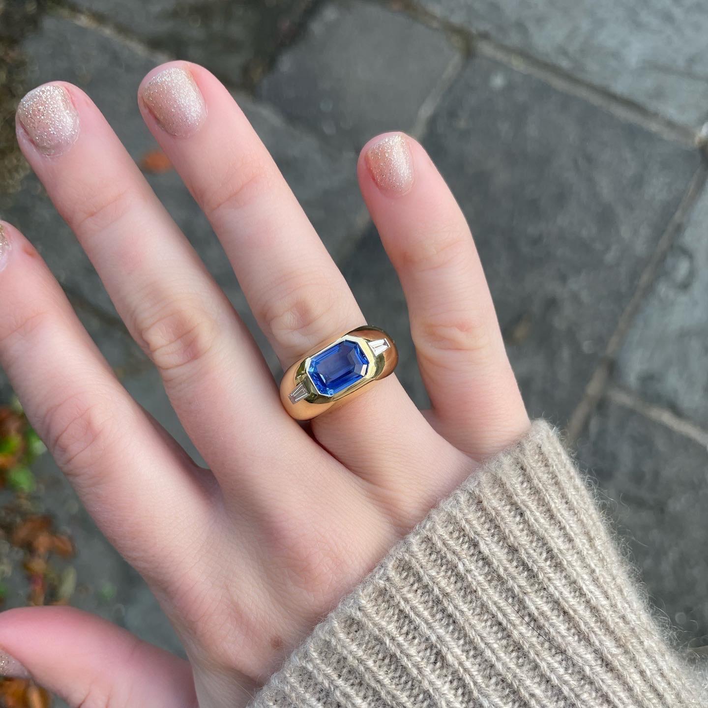 3.16ct Sapphire (No Heat)
0.40ct Diamonds
18k Yellow Gold

This ring is set with a beautiful, emerald-cut 3.16 carat sapphire (untreated), and tapered baguette Diamonds.

Sapphires are part of the Corundum family (Ruby's & Sapphires). They are 9 on