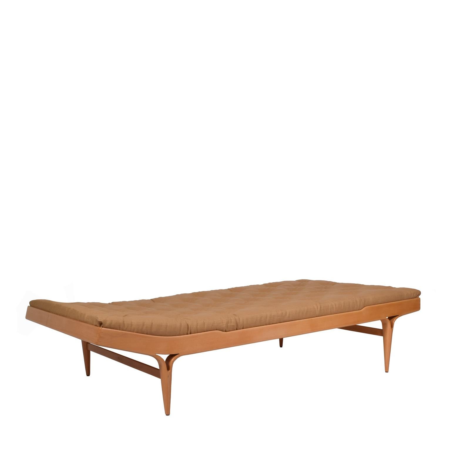 Elegant curving platform daybed in birch with split leg and cotton upholstered mattress. Marked and made by Karl Mathsson and dated 1969.