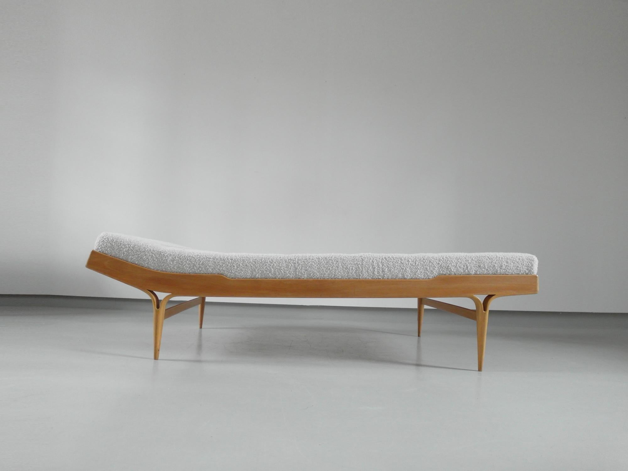 A birch wood Berlin daybed designed by Bruno Mathsson, Sweden 1957. This iconic Scandinavian daybed is known as the Berlin daybed, since it was first shown in 1957 at the International Building Exhibition in Berlin. The bed frame is slightly