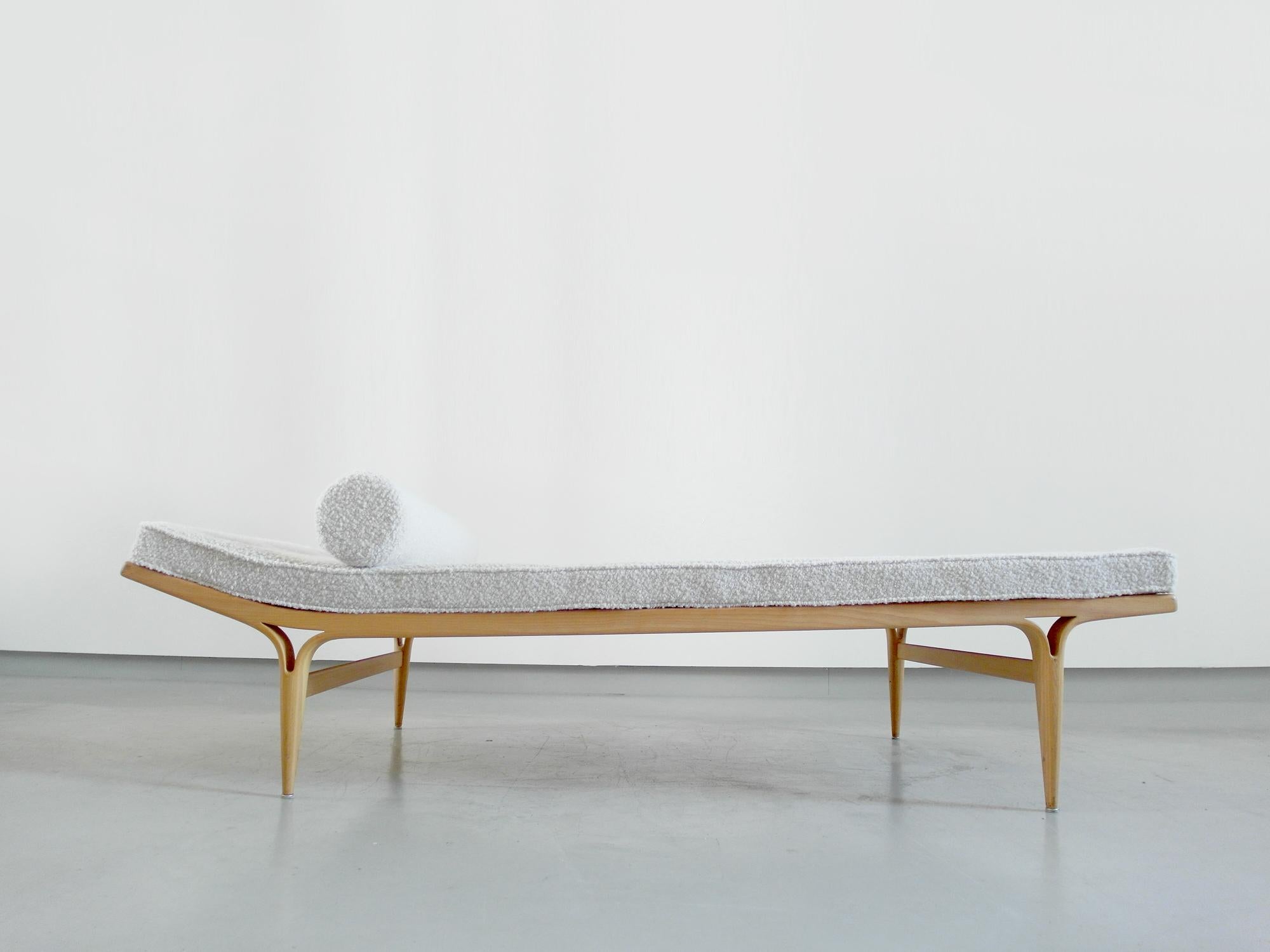 A rare birchwood Berlin daybed designed by Bruno Mathsson, Sweden 1957. This iconic Scandinavian daybed is known as the Berlin daybed, since it was first shown in 1957 at the International Building Exhibition in Berlin. This is for the elegant sleek