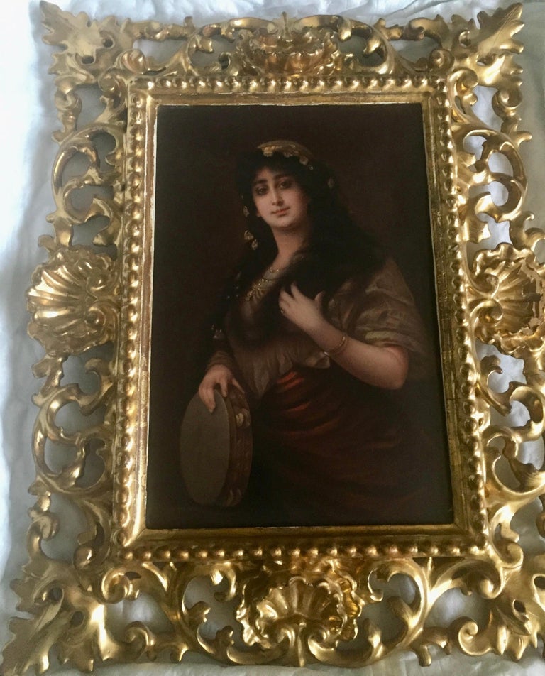 A hand painted porcelain plaque depicting a Gypsy with a tambourine after a painting by Nathaniel Sichel.
KPM mark and painted title on reverse, in a Florentine gilt frame.
Late 19th century, Germany.