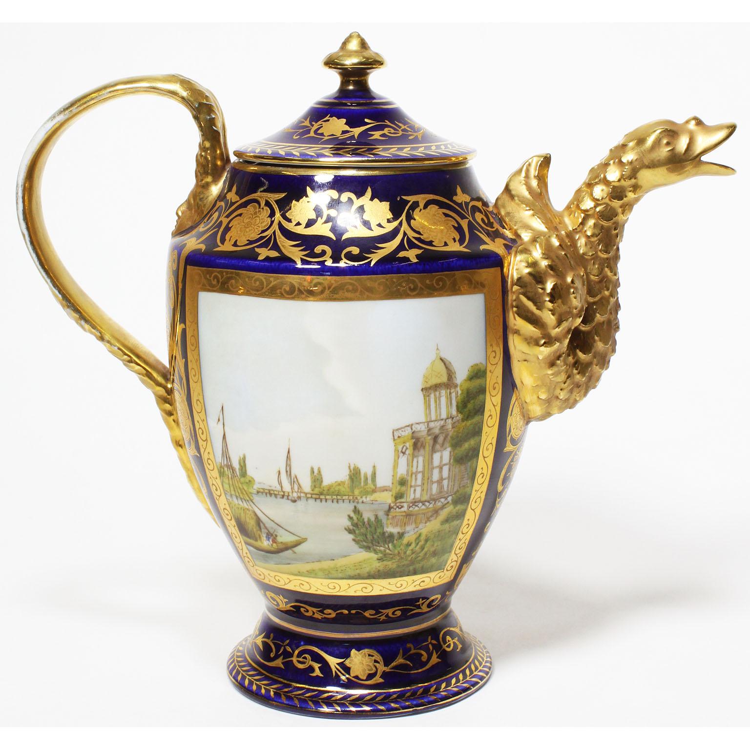 A very fine 19th century Berlin KPM Porcelain Royal five-piece cobalt-blue and 24-carat gold parcel-gilt coffee set. The finely painted and decorated two-serving suite comprising of a coffee pot, a sugar-bowl, a creamer and two coffee cups and