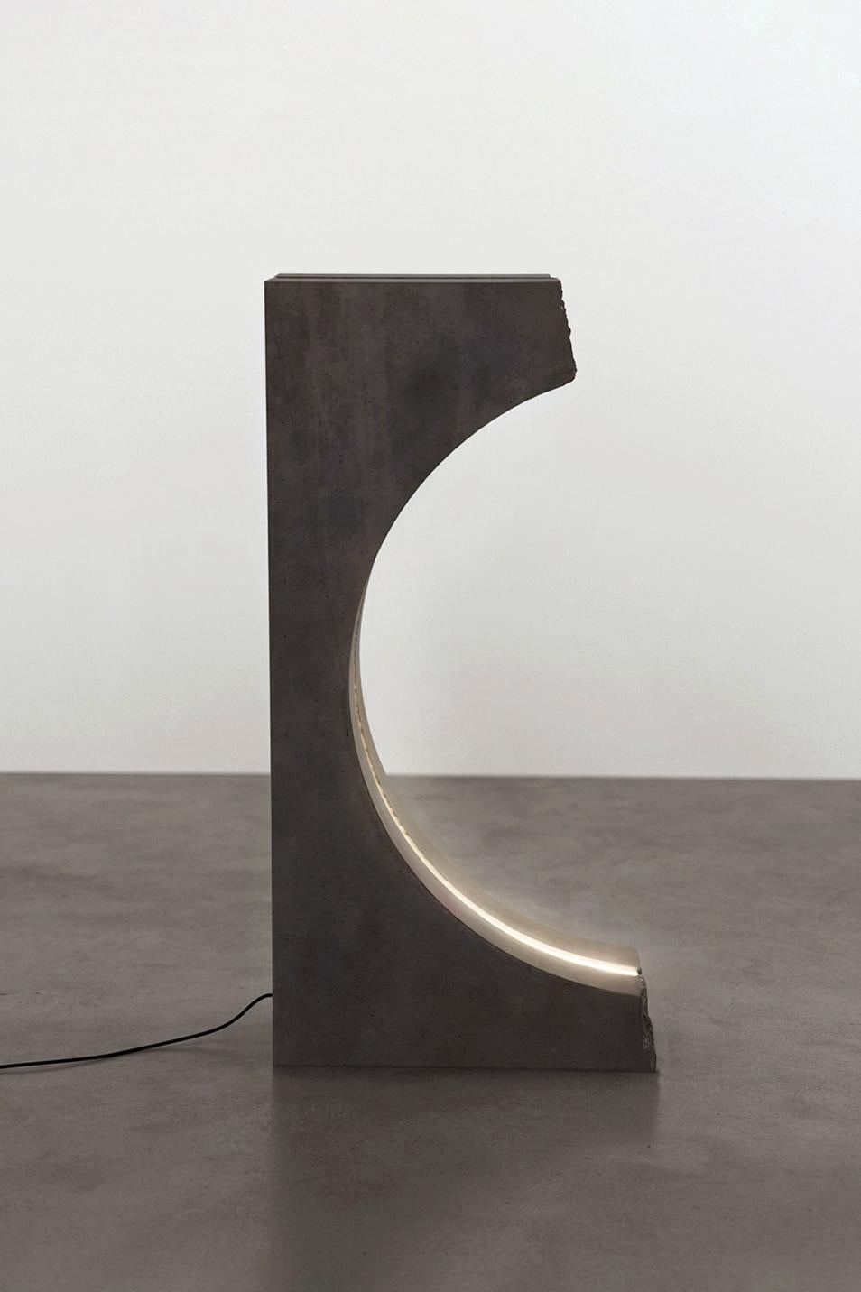 Berlin lamp by Boldizar Senteski
Dimensions: 50 W x 23 D x H 100 cm
Materials: black concrete, steel, led
Sculptural concrete standing lamp with dimmable LED lighting
Growing up in Budapest, Boldizar Senteski was influenced by the eclectic