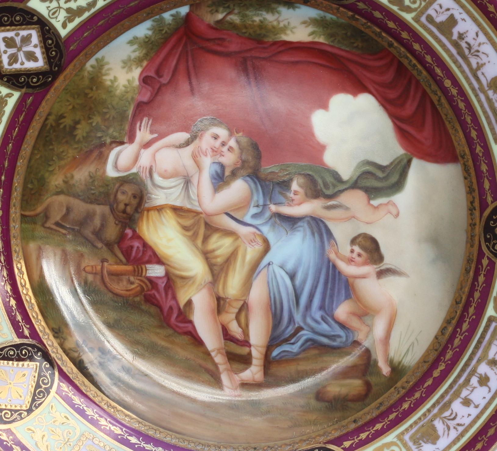 
Berlin Painted and Parcel Gilt Porcelain Cabinet Plate 
The underside marked with an underglaze blue beehive and titled. The recess decorated with a mythological scene with Adonis and Diana, with a claret and celadon borders, reserved with puce