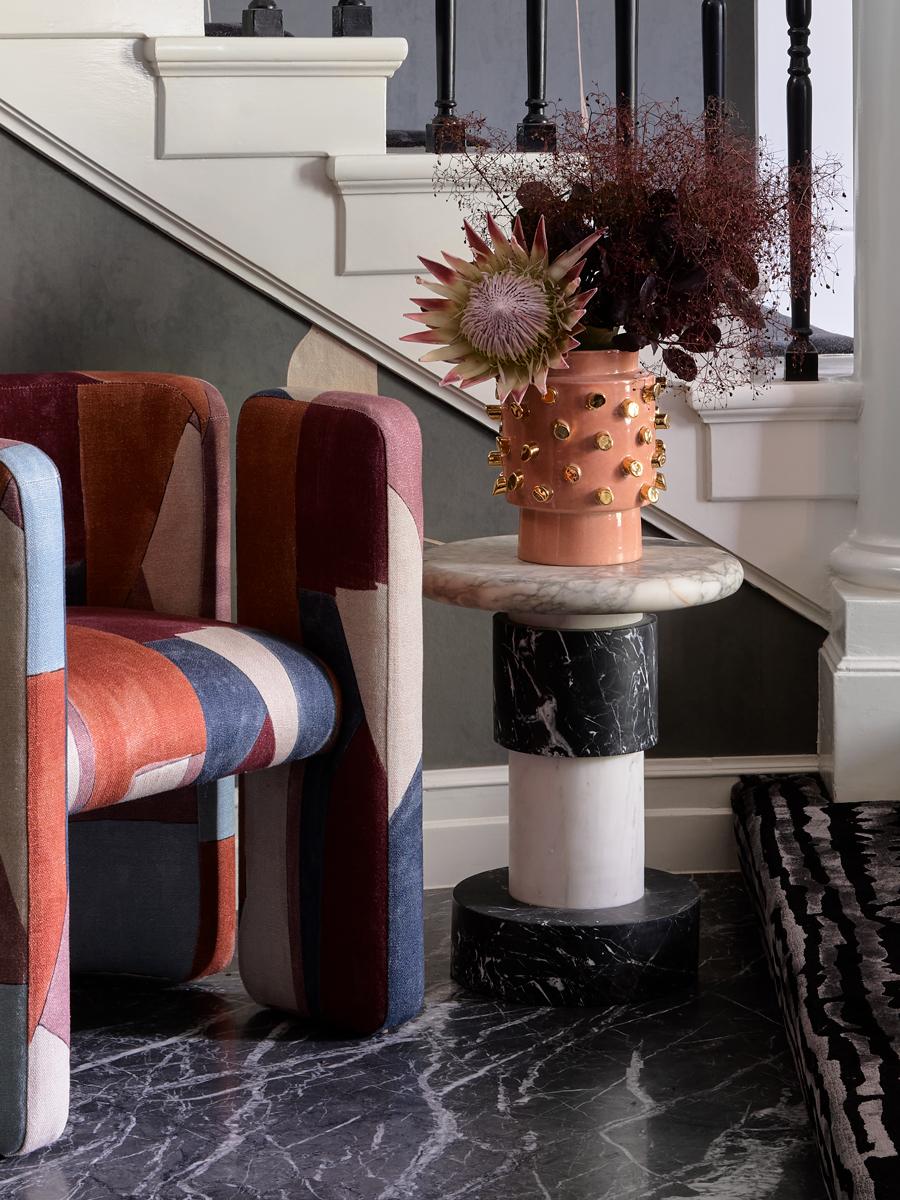 With a nod to the postmodern structures of Ettore Sottsass and a presence all its own, the Berlin side table is a striking study in monochromes and the natural beauty of marble.

Made from solid, honed pieces of Nero, Fiori and Bianco marble, with