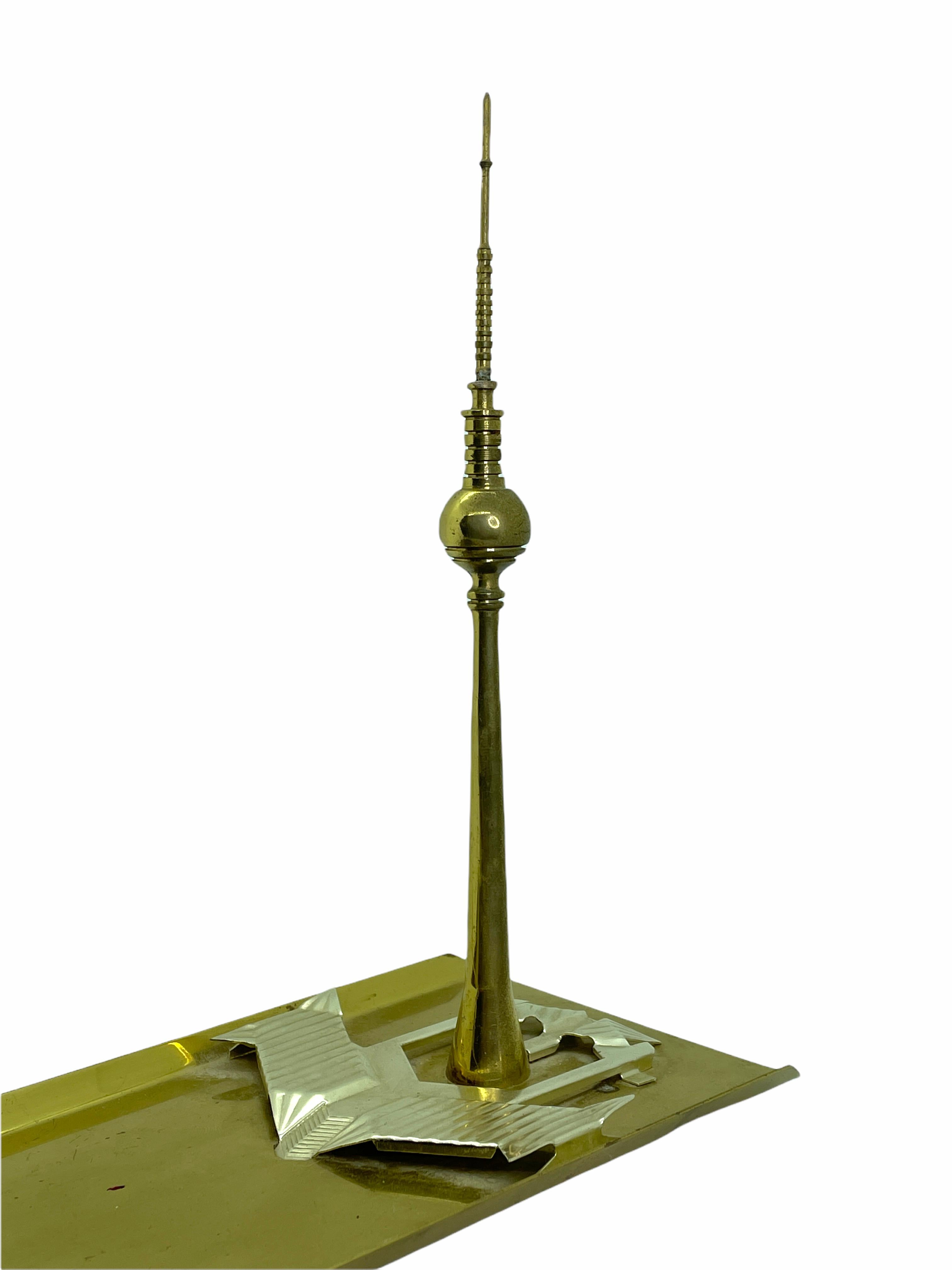 Scaled model of the Berlin television tower. Hand-spun in metal on a metal base. A nice architectural sculpture for every living room or desktop. Use it at a catchall, business card tray or just as a pen holder at your desktop. It measures