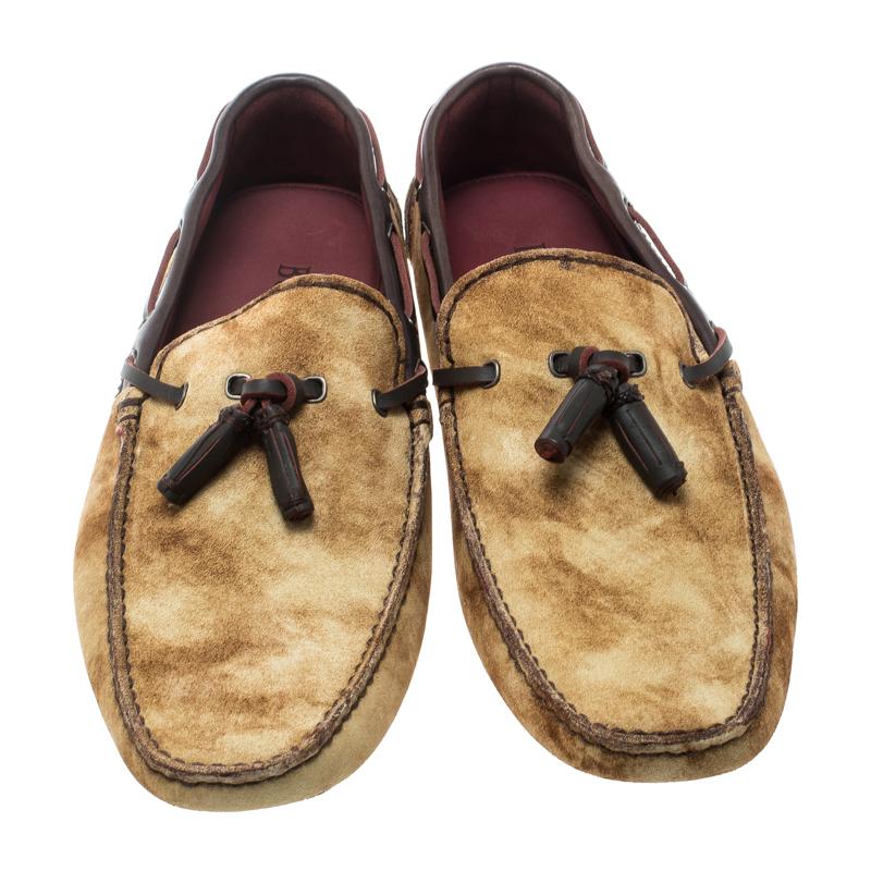 Add some edge to your look with this pair of Berluti two-tone loafers. Made from beige suede, their sophisticated and exotic look is coupled with a boat-shoe design and tassel detail on the vamps. Lined with leather, these loafers can be paired with