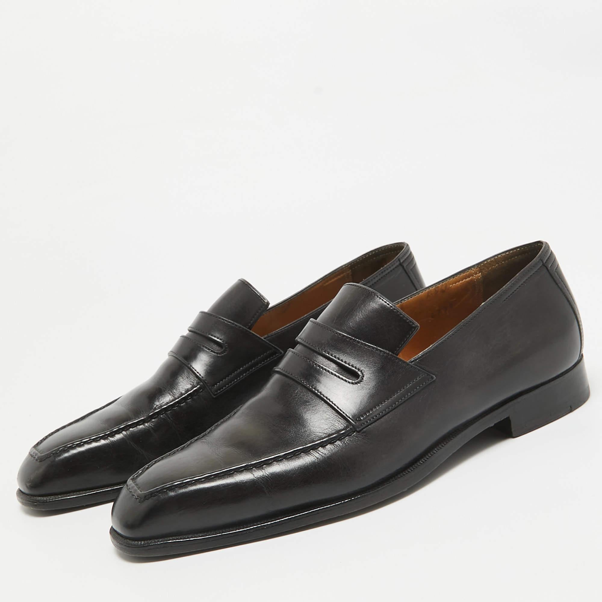 This comfortable pair of loafers by Berluti will make a great addition to your shoe collection. They have been crafted from leather in black and styled with Penny keeper straps. Snug leather insoles beautifully complete the loafers.
