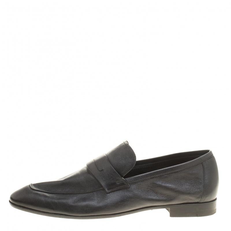 This comfortable pair of loafers by Berluti will make a great addition to your shoe collection. They have been crafted from leather in black and styled with Penny keeper straps. Snug leather insoles beautifully complete the loafers.

Includes: The