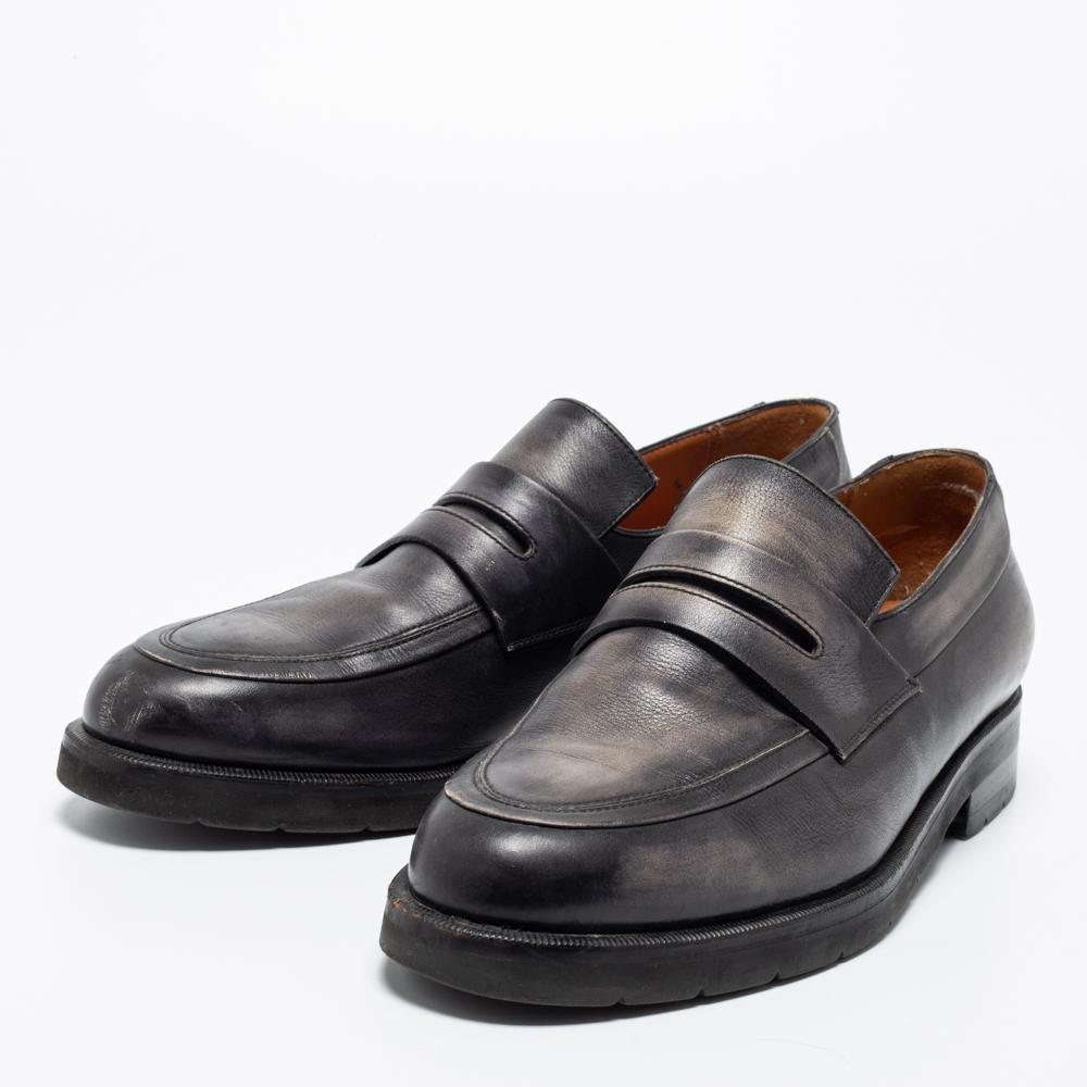 Slip into these comfy yet super-stylish loafers designed by Berluti. The dark grey pair is crafted from leather and will match most outfits with ease. Tough leather soles provide the finishing touches to the suave pair.

