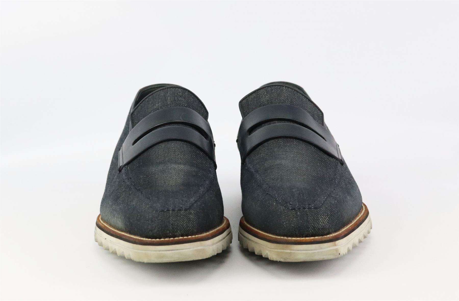 These men’s loafers by Berluti are a modern update to the classic penny loafer, these slip-on shoes come in sleek leather-trimmed intentionally faded denim with contrast white rubber soles. Heel measures approximately 25mm/ 1 inch. Navy leather,