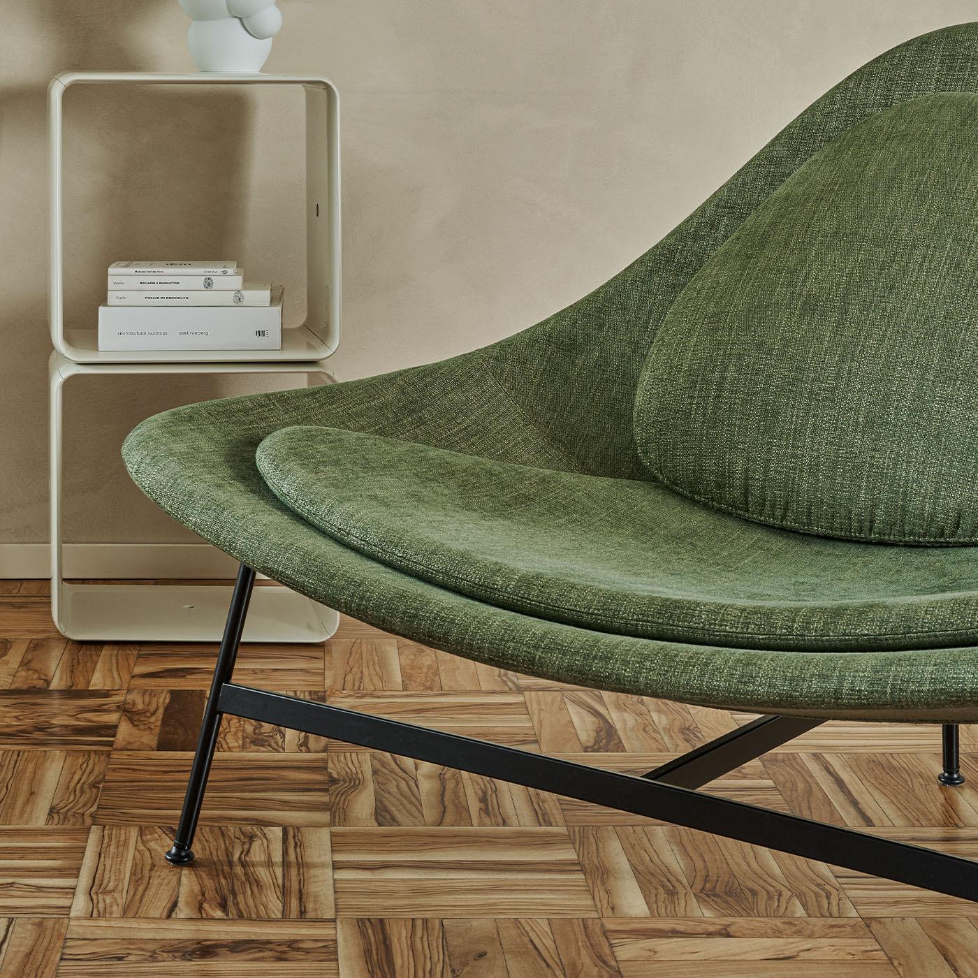 This elegant lounge chair designed by Claesson Koivisto Rune, features a sleek steel frame in matte black. The internal shell is made of cold-foam polyurethane, offering exceptional comfort. Other upholstery options available, including fabrics,