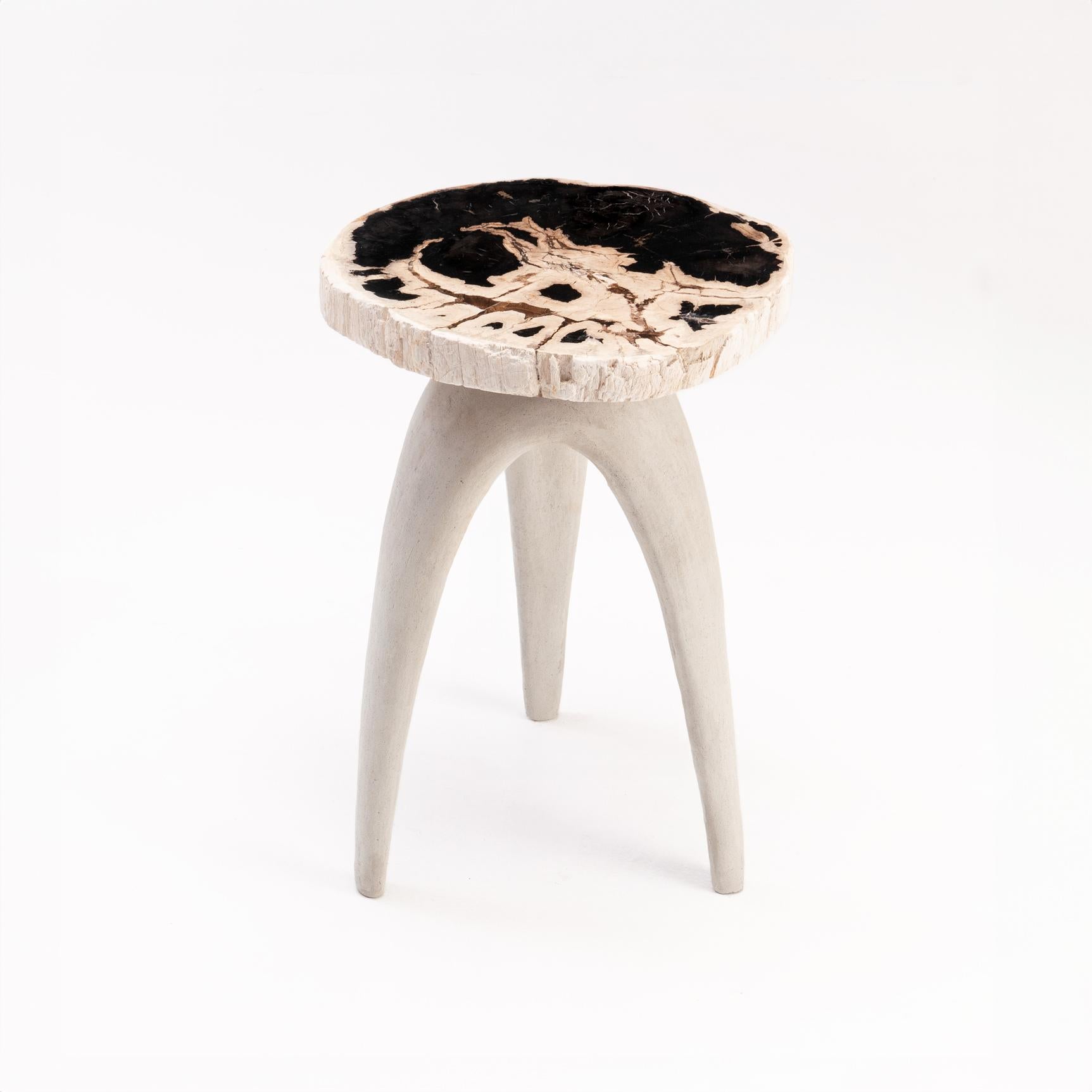 Bermuda Triangle Side Table by Odditi
Dimensions: W 45 x D 42 x H 65 cm
Materials: Petrified Wood, Limestone Composite (Light Colour), Lava Stone Composite (Dark Colour), Steel

The ‘Bermuda Triangle’ sculptural side-table features a solid petrified