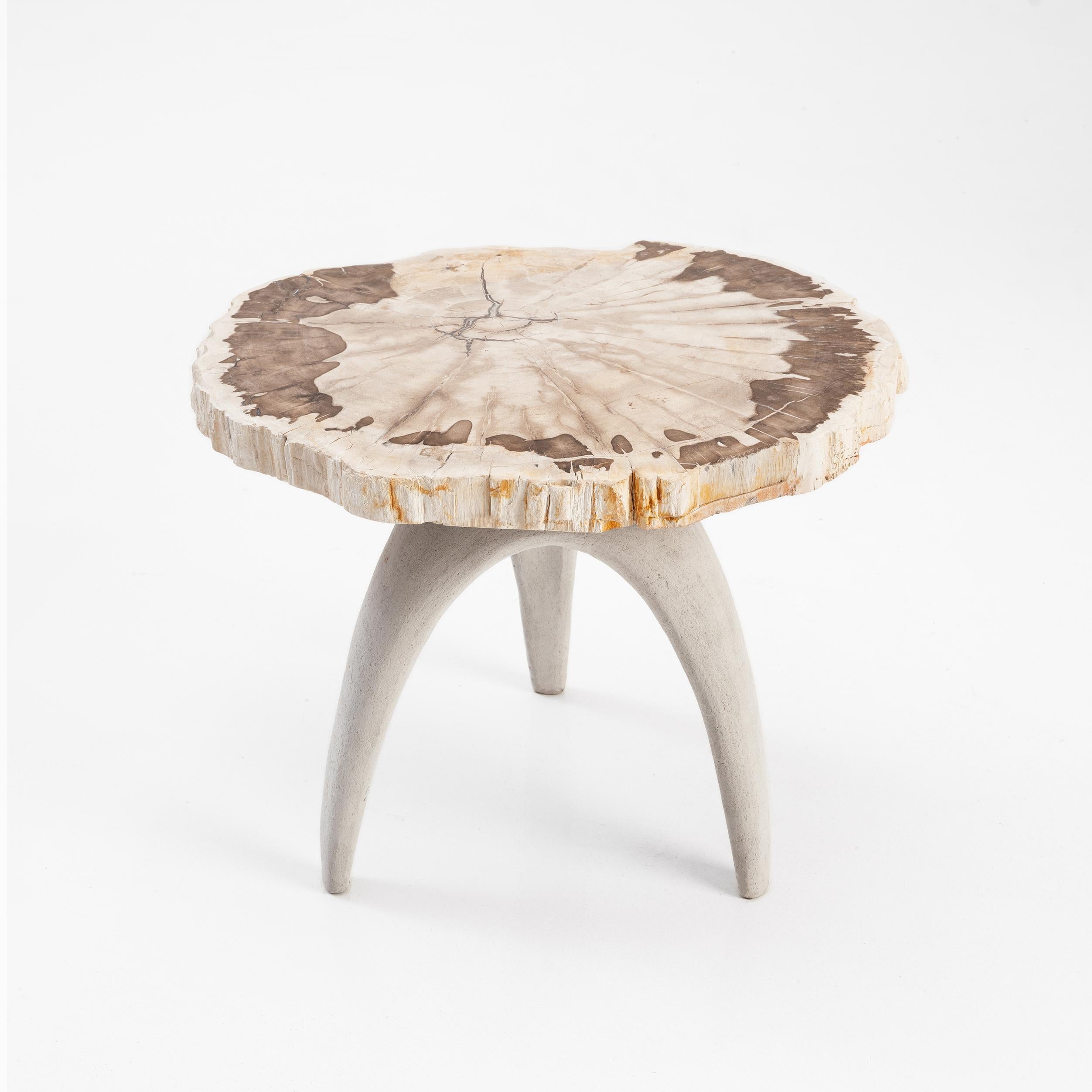 Bermuda Triangle Table by Odditi
Dimensions: W 56 x D 46 x H 45 cm
Materials: Petrified Wood, Limestone Composite (Light Colour), Lava Stone Composite (Dark Colour), Steel

The ‘Bermuda Triangle’ sculptural table features a solid petrified wood top,