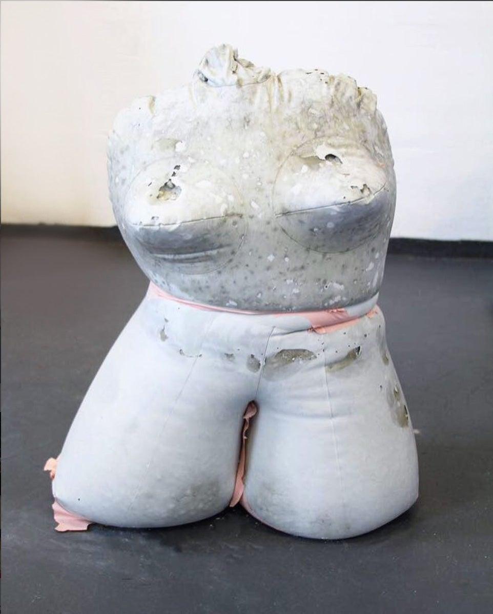 Inflatable Love Doll #9 (2015-2017)

Dimensions: 22 in. H x 13 in. W x 12 in. D (70 cm H x 30 cm W x 38 cm D)
Concrete sculpture made with plastic and iron.

A series of feminine cement chests comprised of plastic sex dolls filled with concrete, at