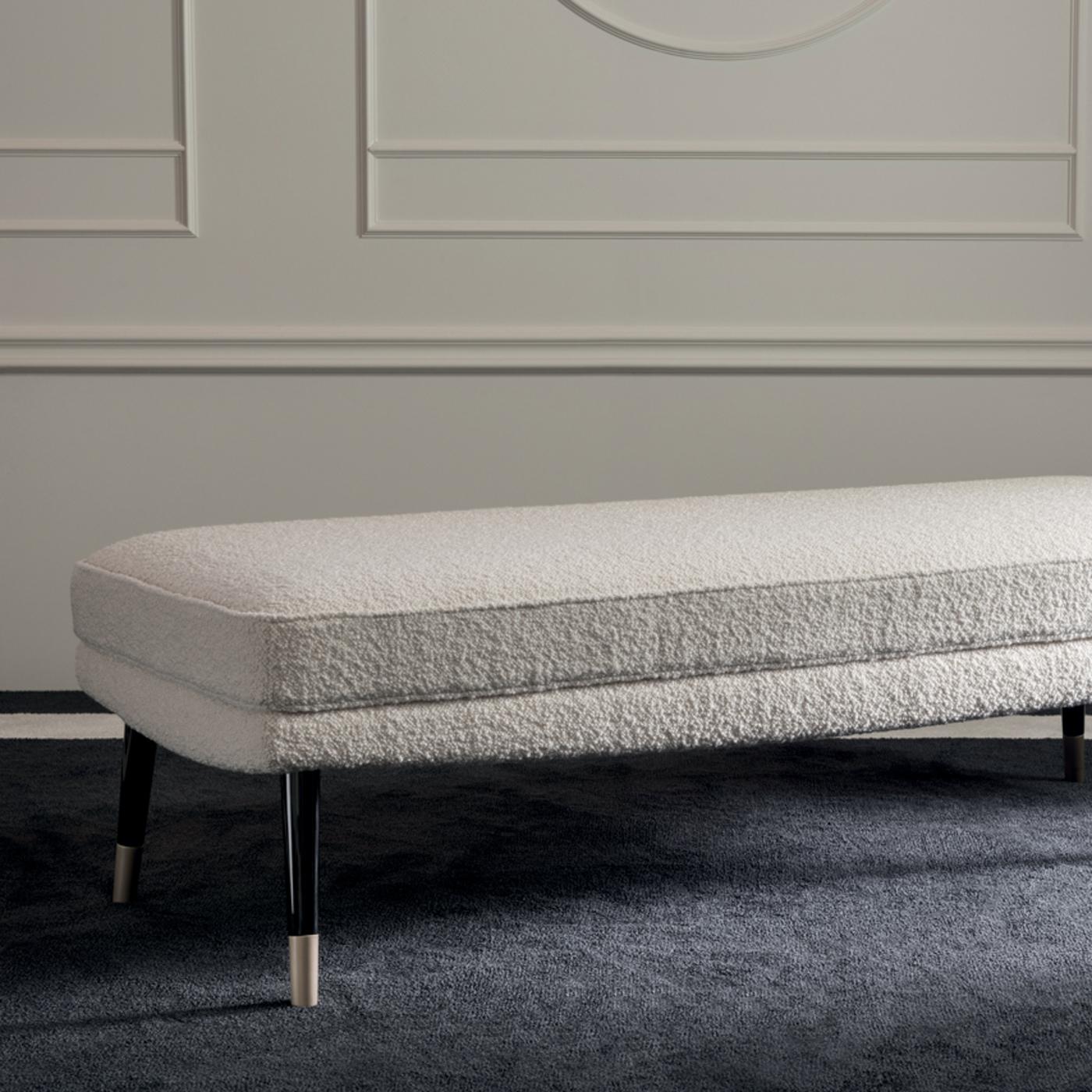 Marked by sartorial appeal and retro flair, this exclusive bench of the Bernadette collection is a Classic home accent that will never go out of style. The compact, rectangular frame showcases a cushioned seat (40 cm high) upholstered in refined