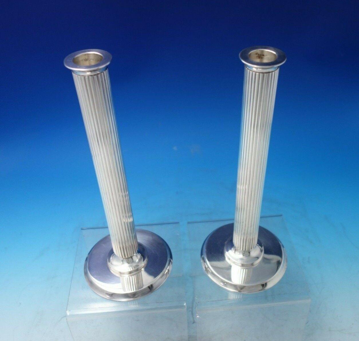 Bernadotte by Georg Jensen.

Impressive Bernadotte by Georg Jensen sterling silver candlestick pair marked #855B. The candlesticks measure 10