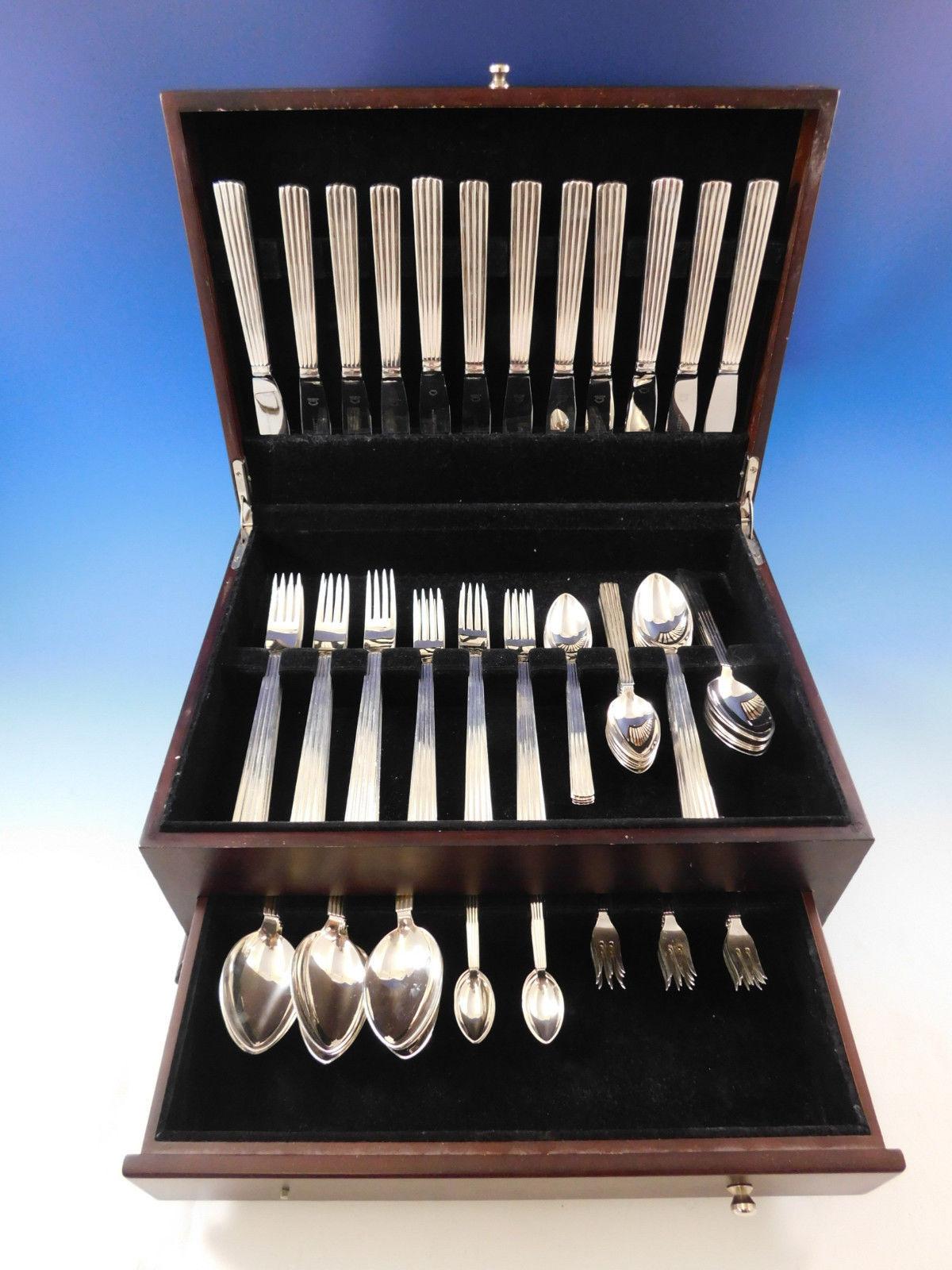 Outstanding dinner size Bernadotte by Georg Jensen sterling silver flatware set of 94 pieces. This set includes:

12 dinner knives, long handle, 9