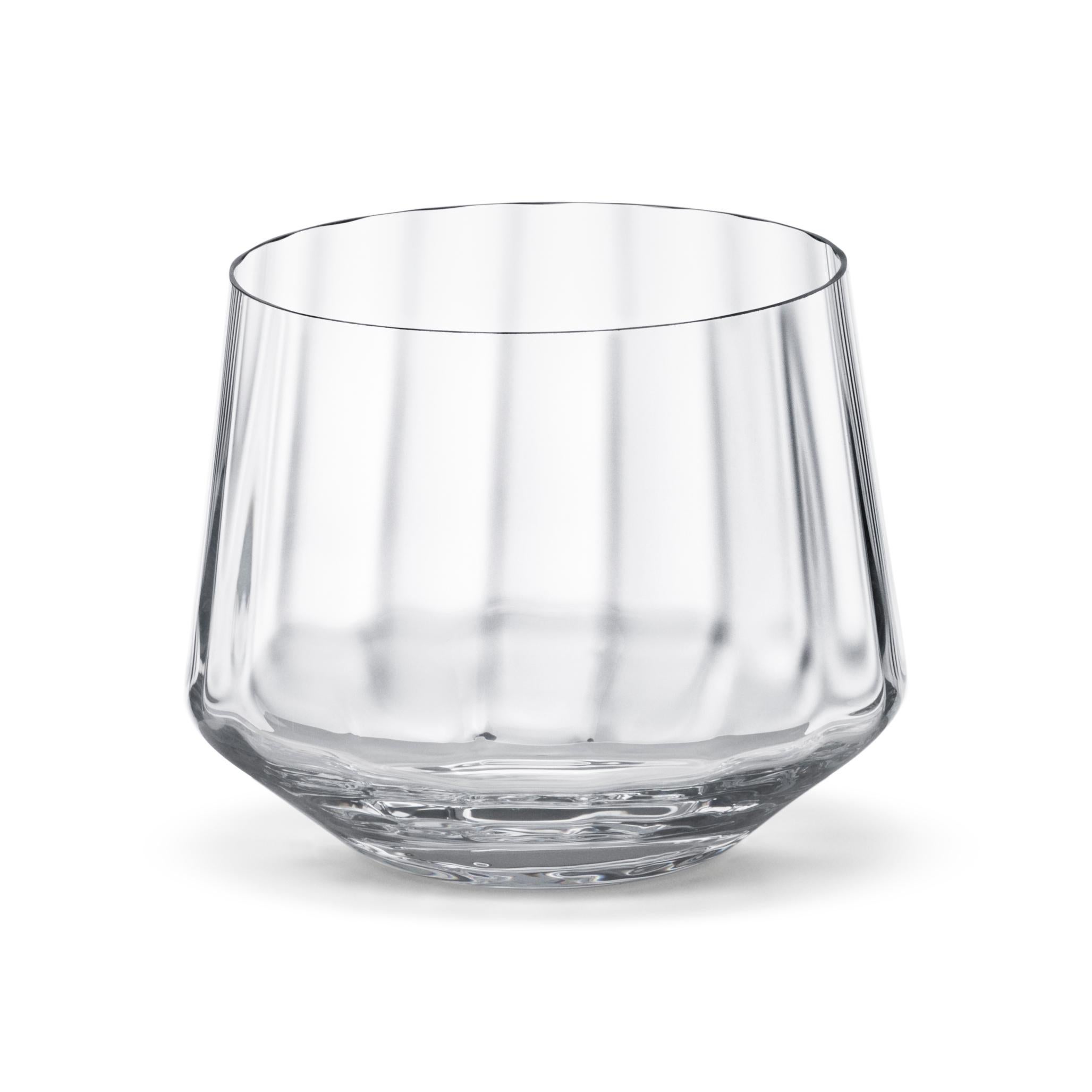 Eye-catching and stylish, this set of six lead-free crystal tumblers brings the Scandinavian design to your table setting. The gentle grooves that echo the details in early Art Deco silverware not only add visual interest but also allow the glasses
