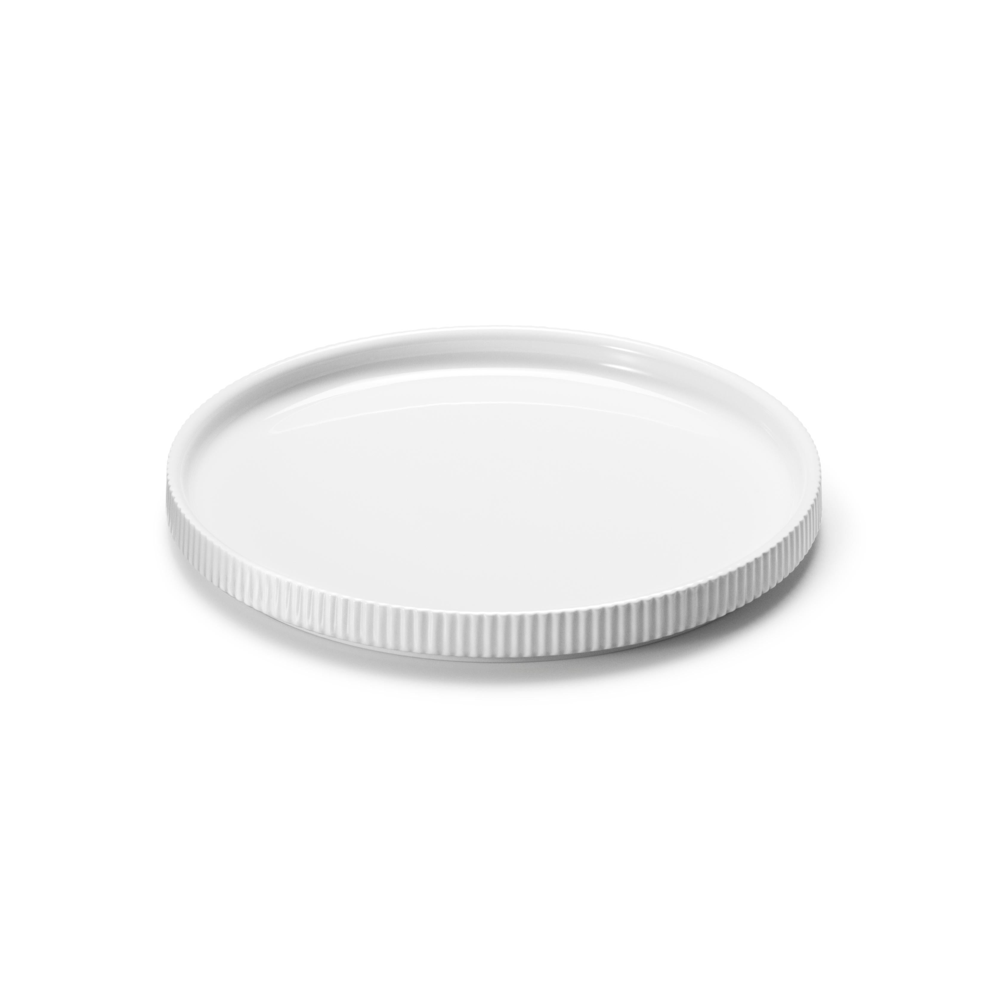 Minimalist yet still with subtle detailing, this small porcelain plate is perfect for lunch and salads. The small ridges add a tactile element that references Bernadotte’s functionalist Art Deco aesthetic whilst the flat shape of the plate is