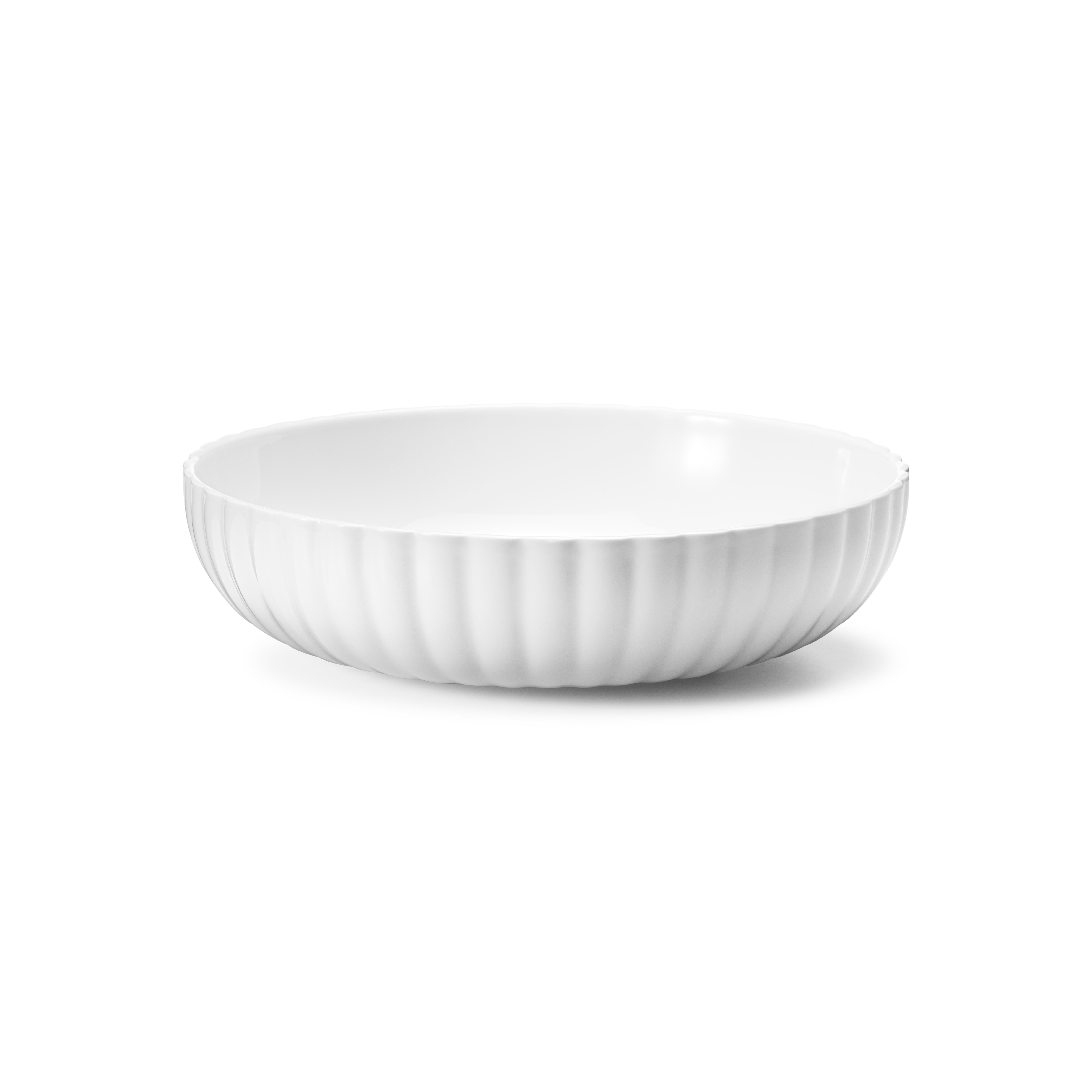 This elegant and understated porcelain bowl - decorated simply with gentle grooves that invite touch - is the perfect all-purpose dish, suitable for everything from breakfast cereal to soup or side salads. When combined with matching plates and
