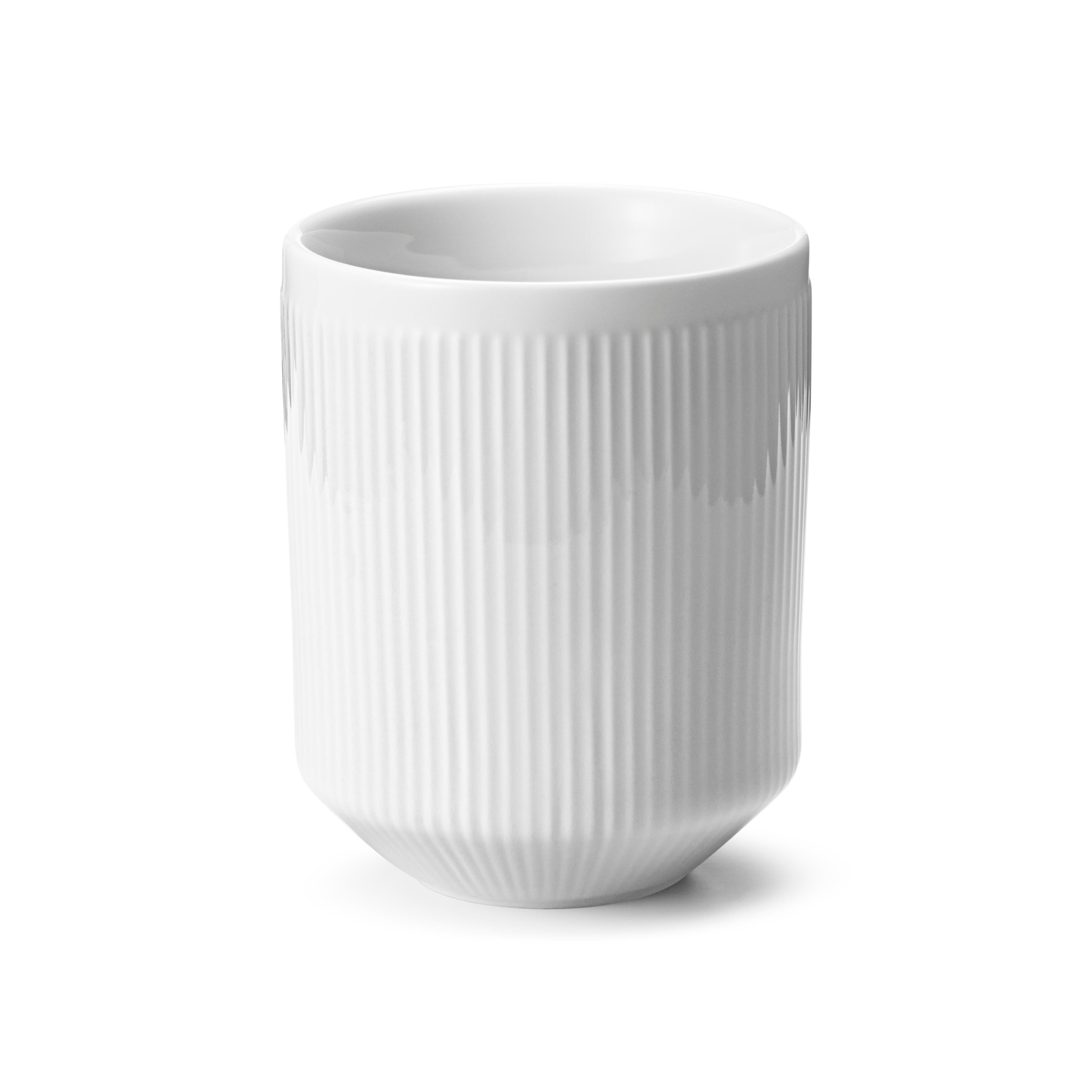 A beautiful example of Scandinavian design, these white porcelain thermo mugs combine both form and function whilst retaining a cool and contemporary aesthetic. The fine grooves on the surface reference early Art Deco style and give a minimalist