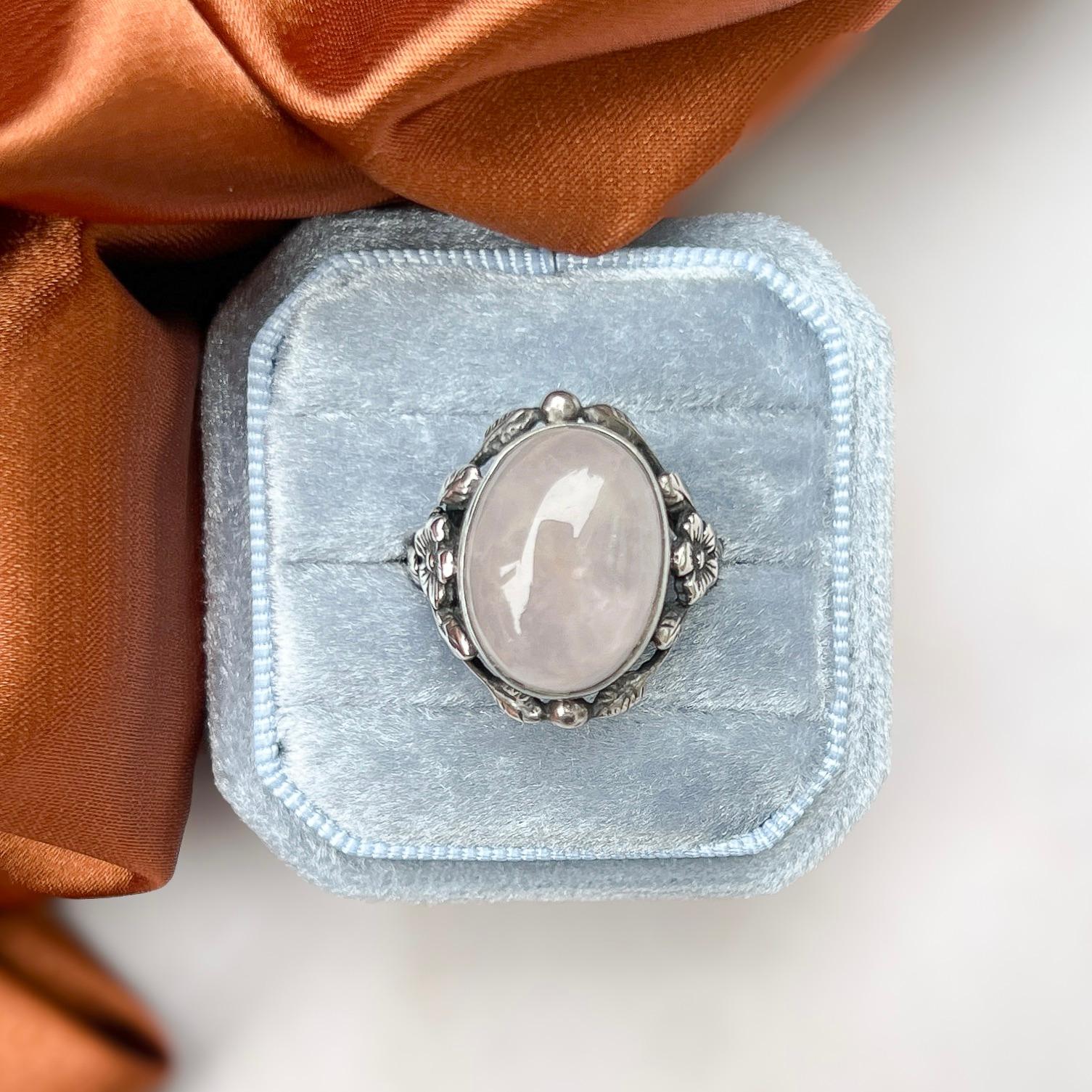 Featuring a pretty Arts and Crafts style design, this silver ring can be attributed to the maker Bernard Instone. 

Condition Report:
Excellent

The Details...
This ring is created from silver. It is stamped 'SILVER' on the inside of the band. The