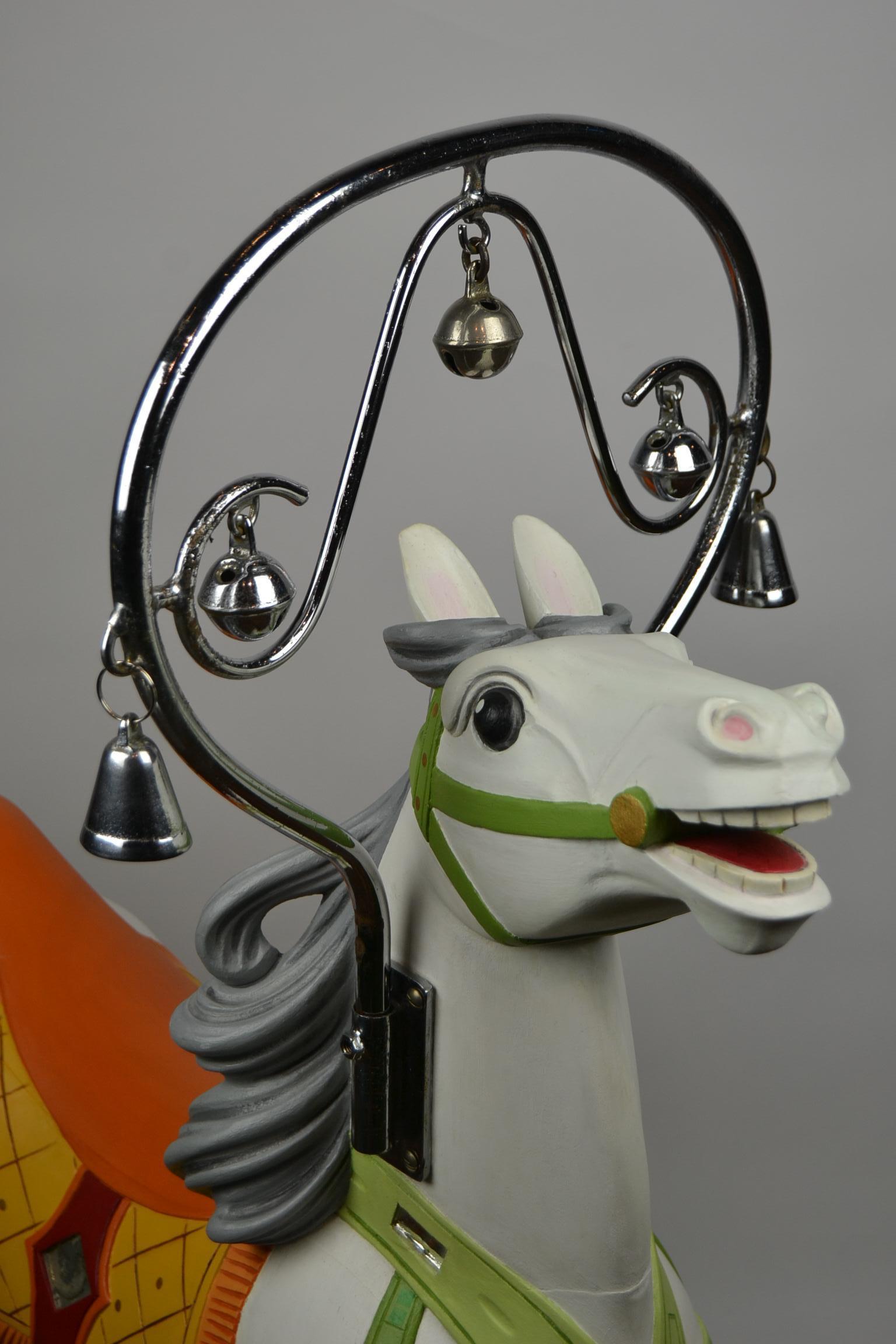 Elegant fairground horse by Bernard Kindt from the 1950s.
This hollow wooden horse was made for a carousel - roundabout - merry-go-round and is now placed on a metal turning base. 

Master sculptor Bernard Kindt was born in 1934 in Herseaux -