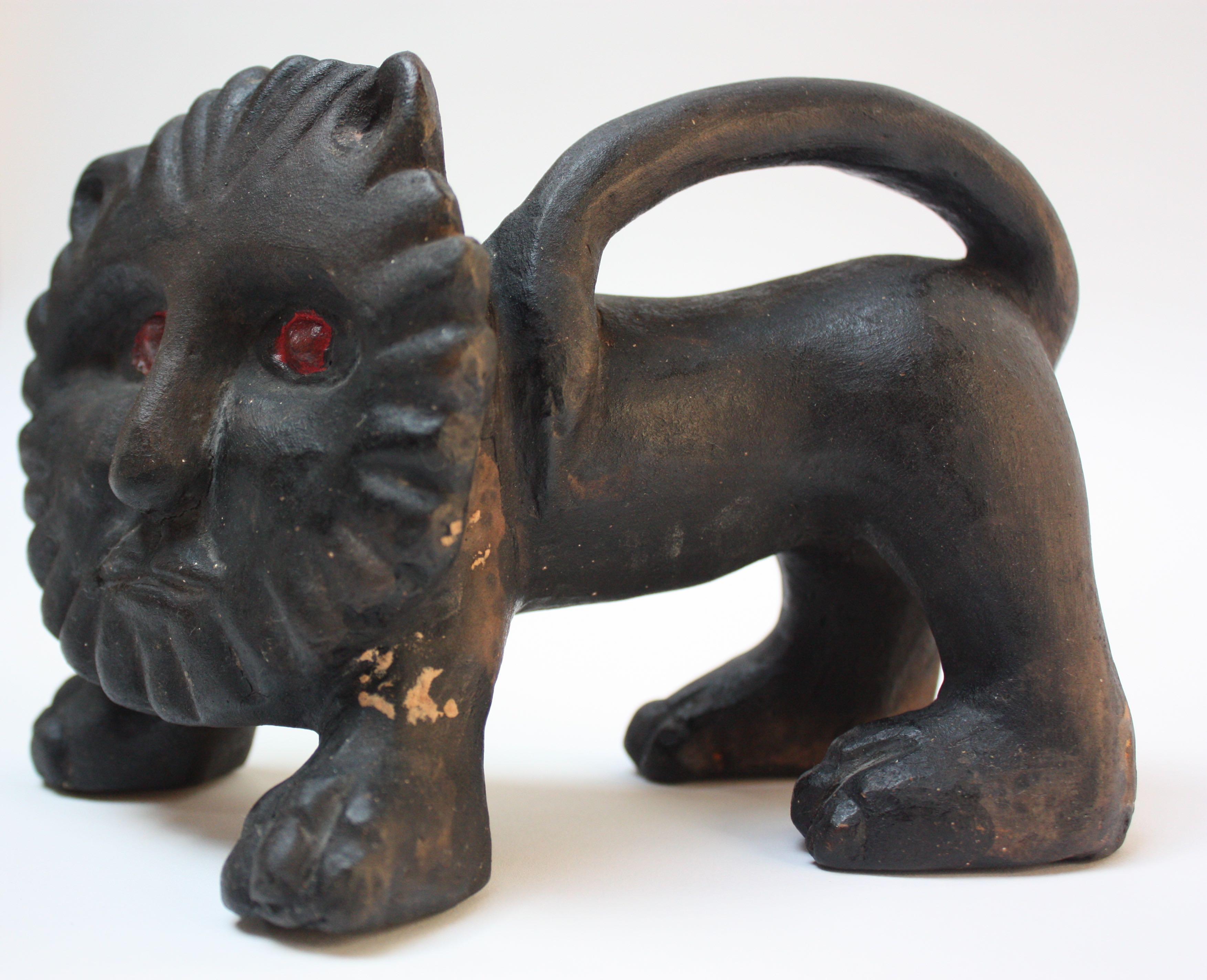 Small terracotta lion sculpture by prolific artist, Bernard Langlais. This example is uncommon for Langlais, whose avid exploration of the animal kingdom was largely dominated by his carved-wood sculptures. Although, he worked in all mediums, his