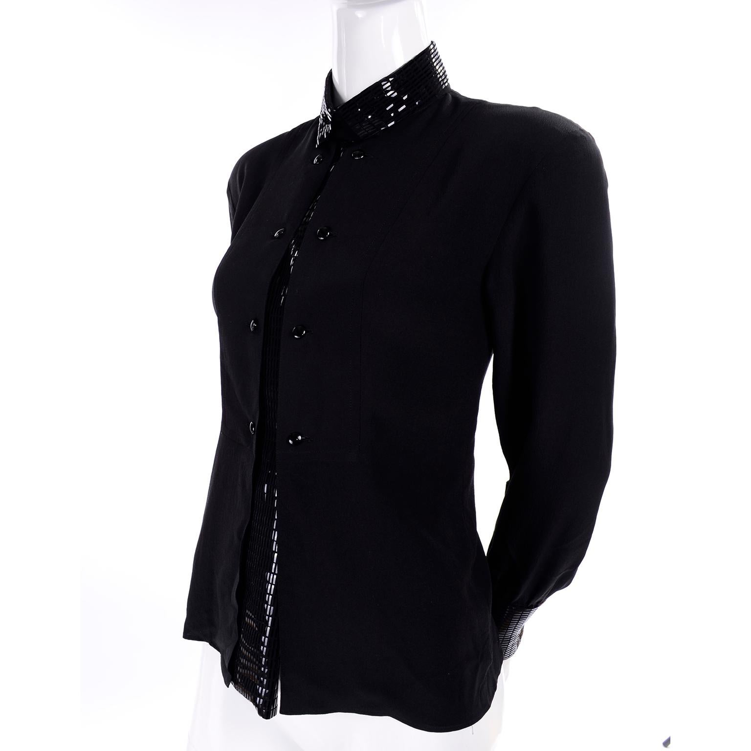 This is a remarkable Bernard Perris 1980's vintage silk black blouse with an attached reflective beaded black dress dickie! This blouse has a unique faux dickie, with black long reflective shiny rectangle bead like decoration carrying from the