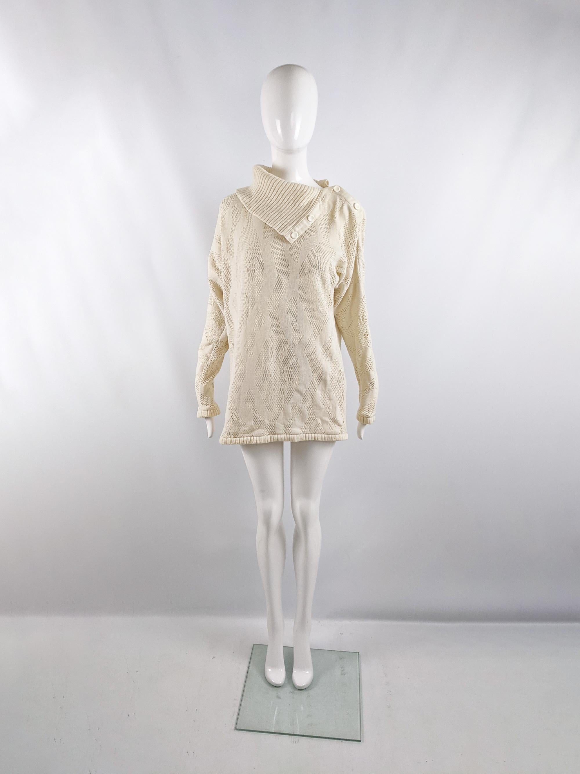 An incredible vintage womens jumper / sweater from the 80s by luxury French fashion designer, Bernard Perris. In a cream knit fabric with an amazing, experimental knitted technique, creating a wavy pattern with varying degrees of looseness which