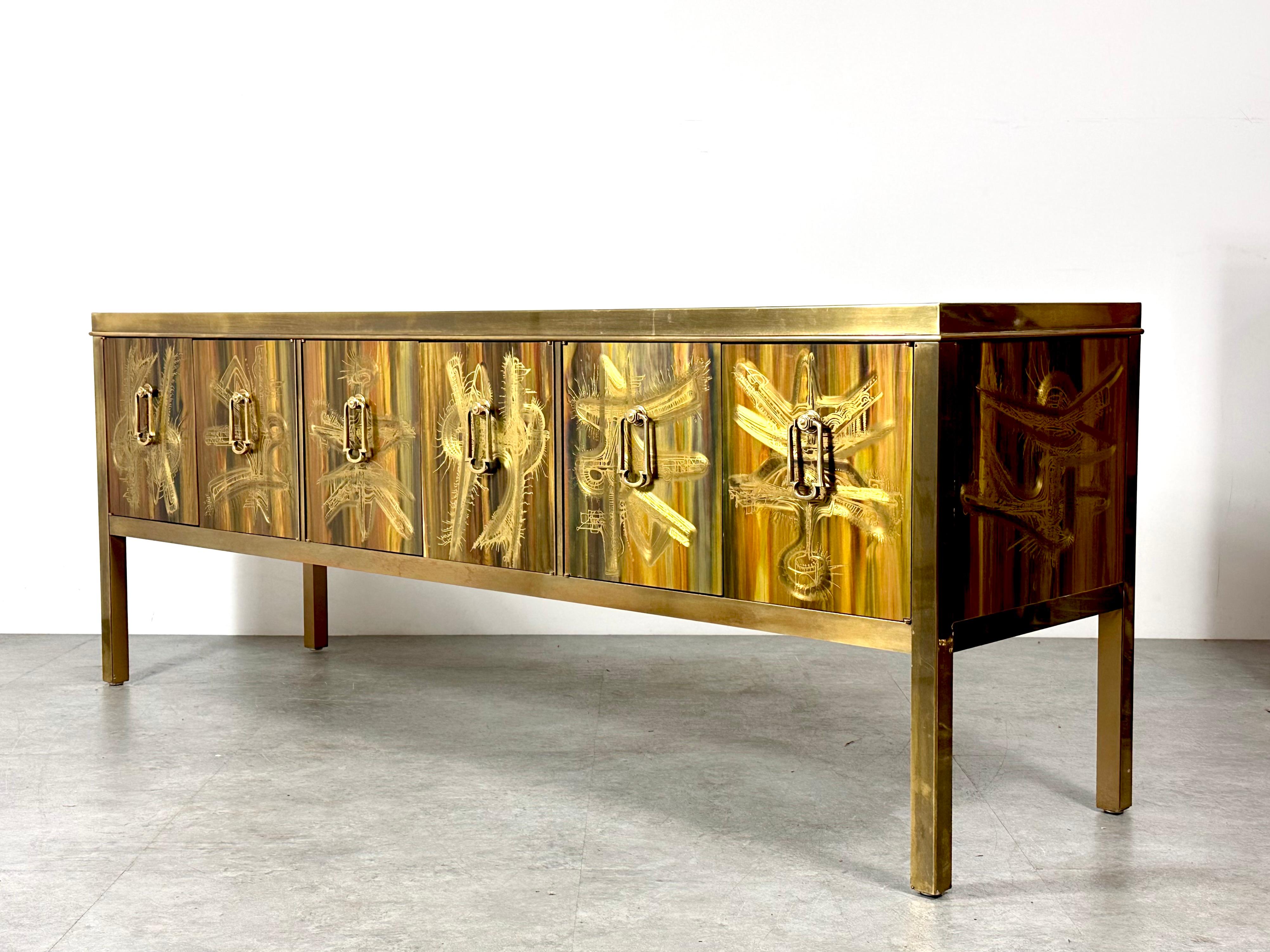 Exquisite six door sideboard designed by Berhnard Rohne for Mastercraft circa 1970s

The cabinet features Rohne's signature acid etched panel work framed in burnished brass with solid hanging pulls

Finished interior storage 

Mastercraft plaque