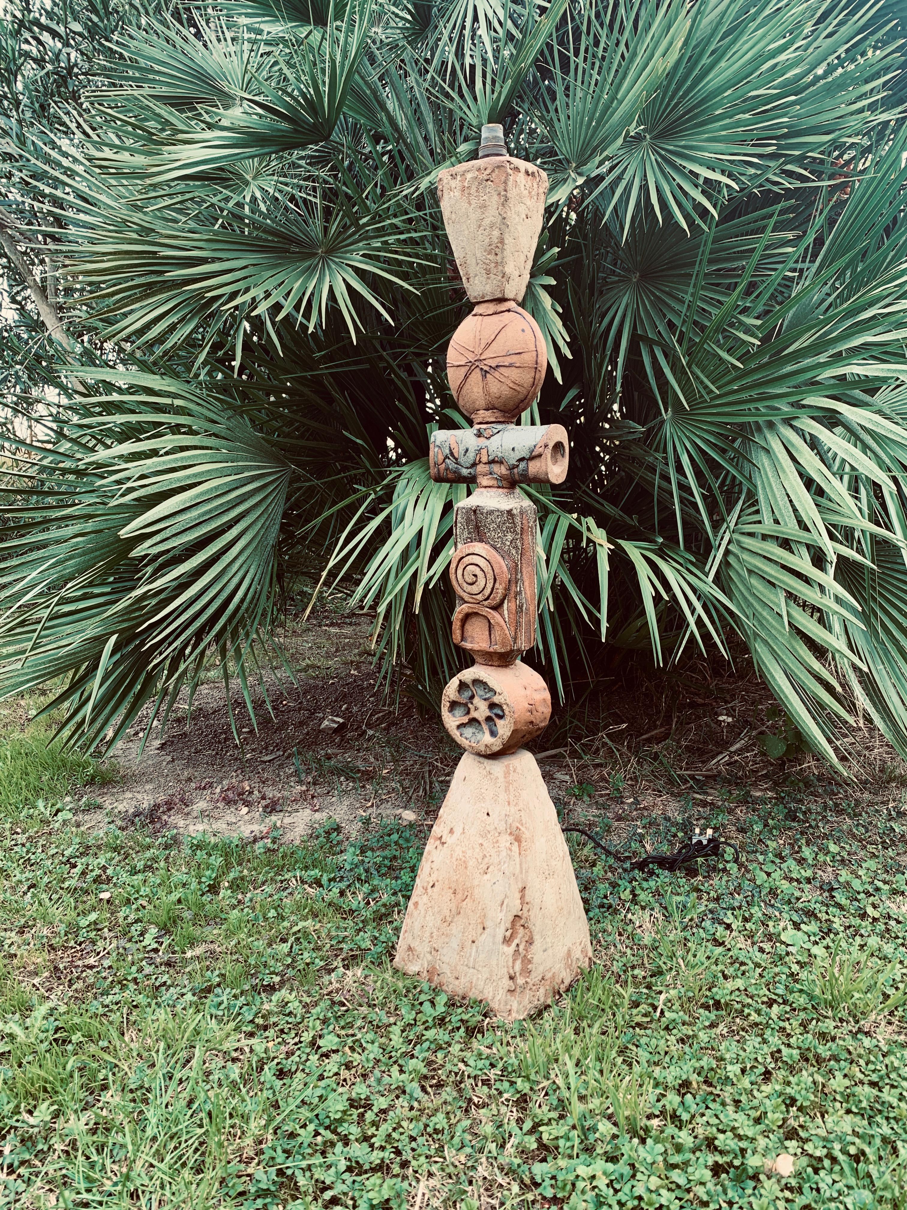 Very large Totem lamp in stoneware, handmade, double-sided patterns.

Dimensions (without lampshade and socket) :

97cm x 20cm x 18cm