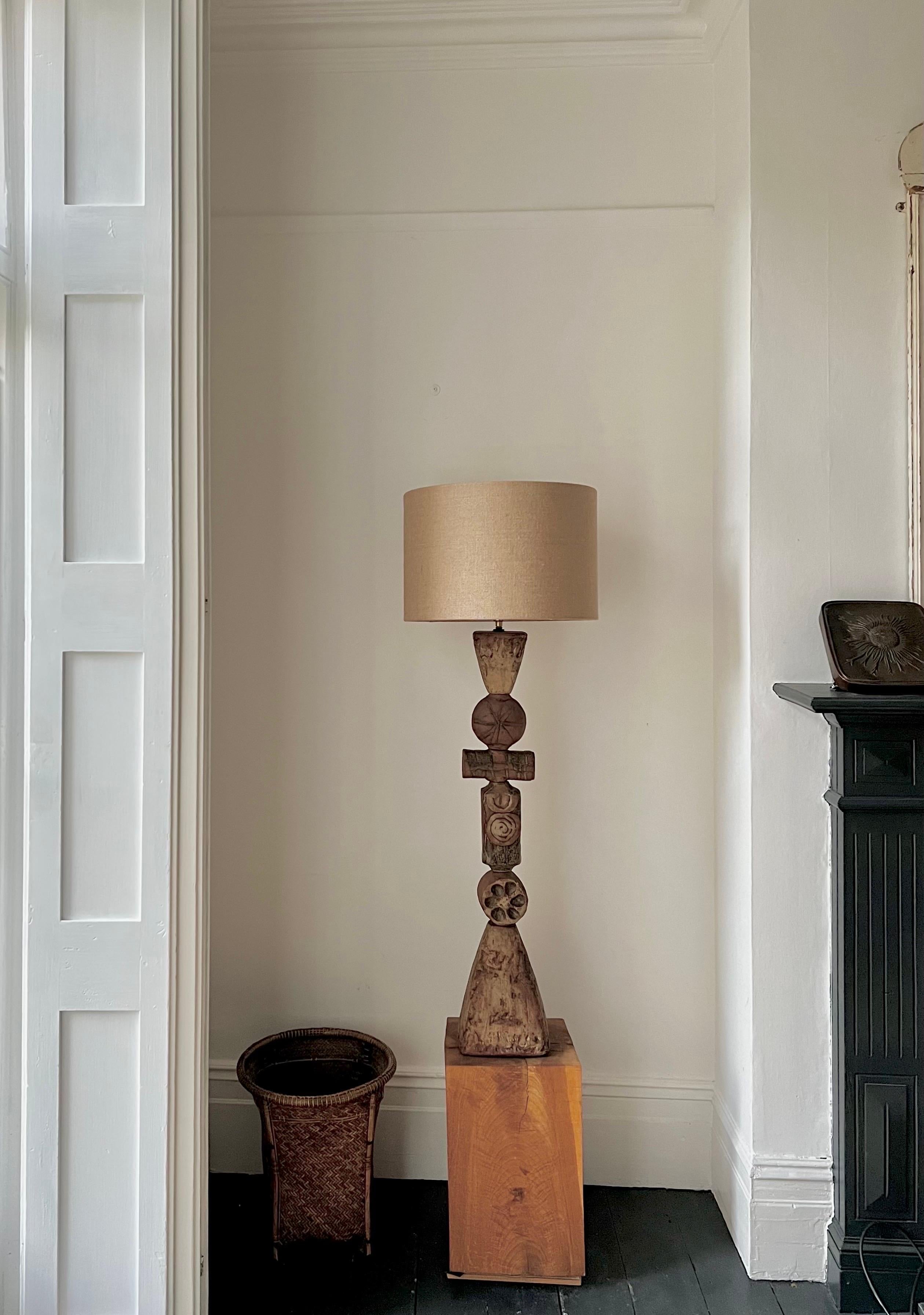 A mid-20th century totem lamp by ceramicist Bernard Rooke, England. 

An early piece, and unusual to see this example of Rooke's work; hand-built, with great character. A tall piece for the floor or a low plinth. This model has a large textured