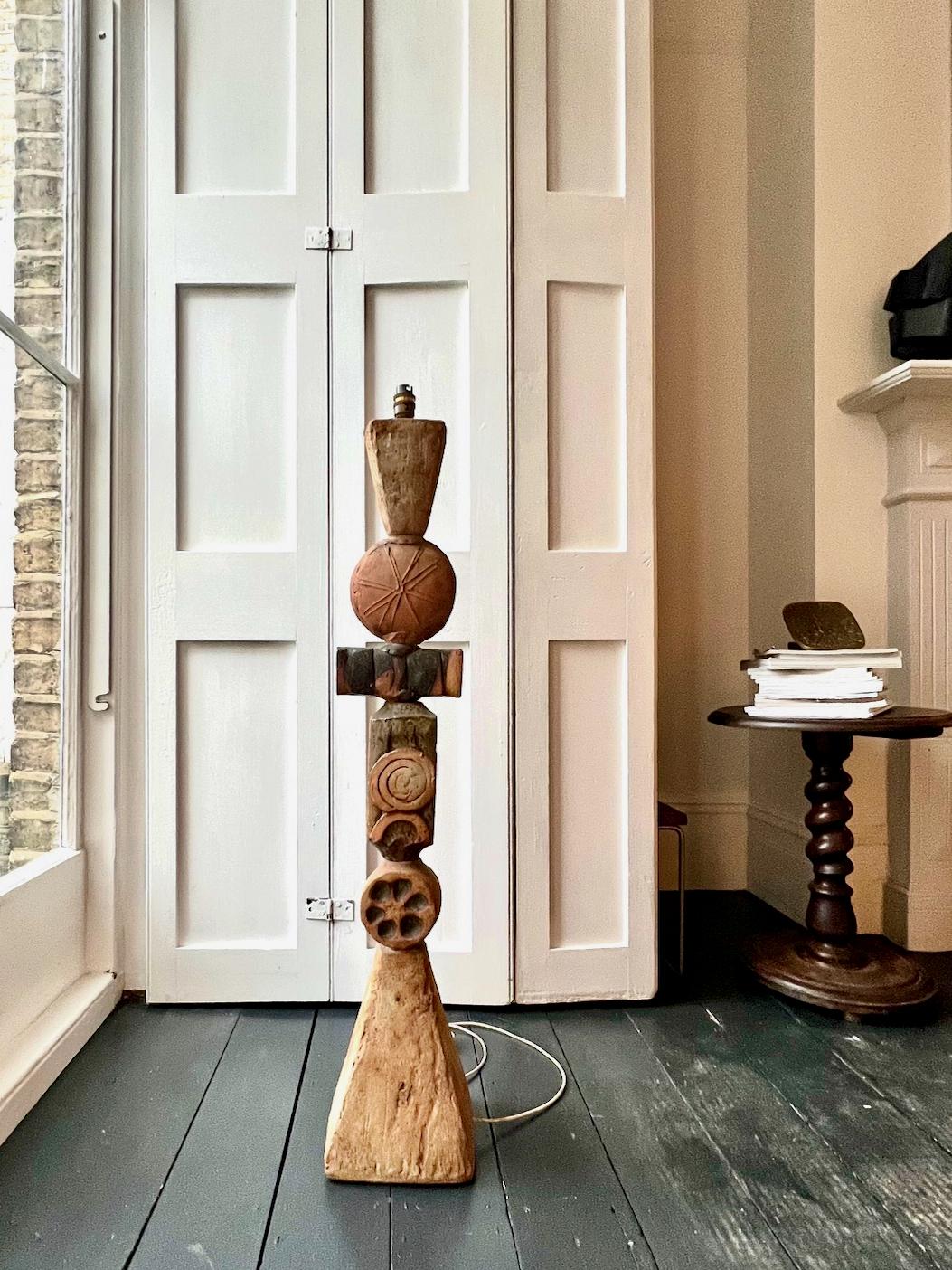 A mid-20th century ceramic totem lamp by Bernard Rooke, England. 

An early piece, hand-built, in neutral brown tones of terracotta and stone, and areas of applied grey/brown glaze. This model has a large textured pyramid base, with the smaller