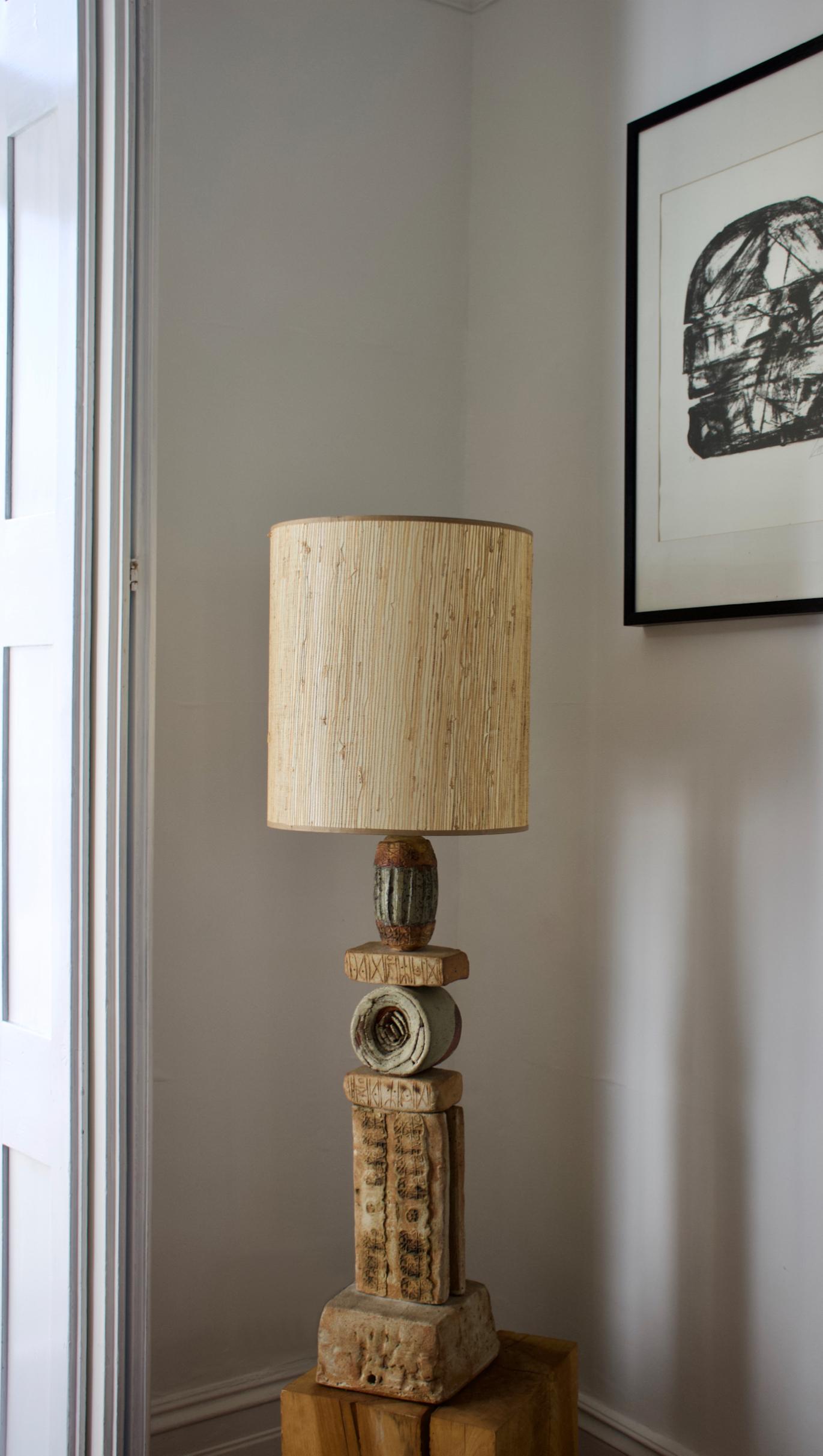 A single large, or oversize, ceramic TOTEM table lamp by Bernard Rooke, England, 1960s.

Sculptural piece, made of hand-made ceramic elements in natural tones of terracotta and stone, with a combination of dry and glazed finishes. The lamp is made