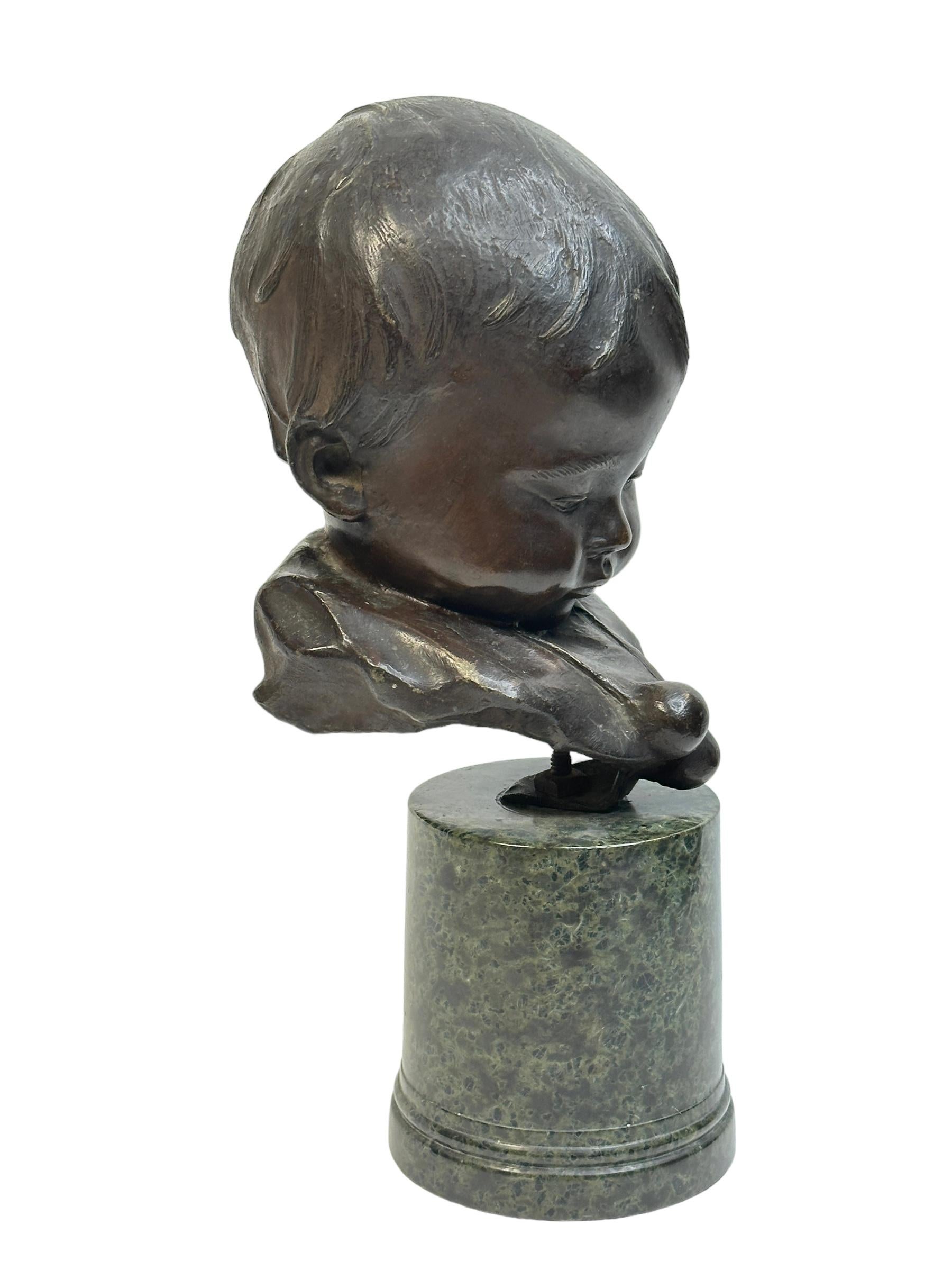 A classic very decorative bronze statue by Bernardo Balestrieri depicting a Boys Head. The bronze 1884 and past away 1965 - This Bronze is known as 