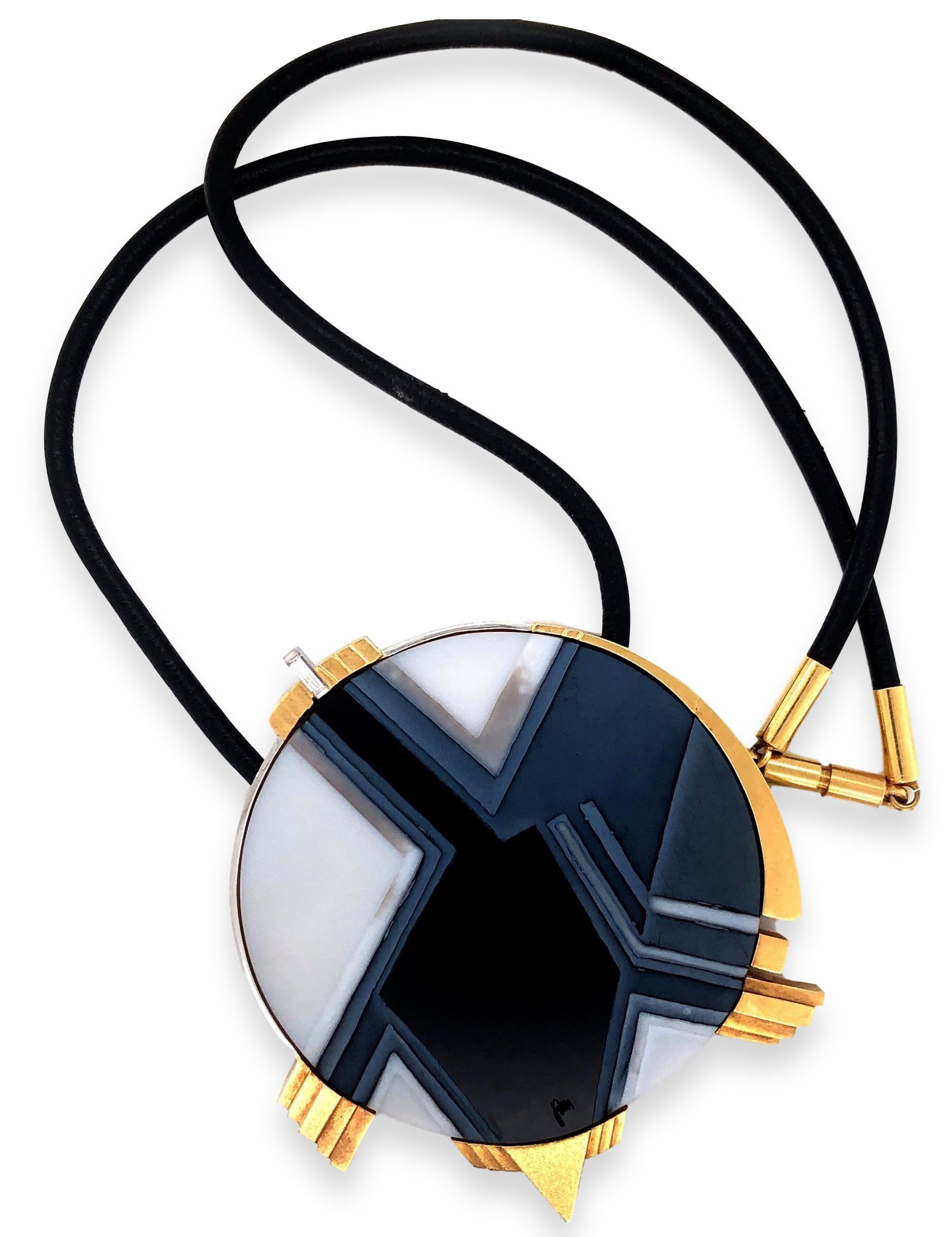 Carved black and white agate pendant/brooch necklace by Atelier Munsteiner. The 2
