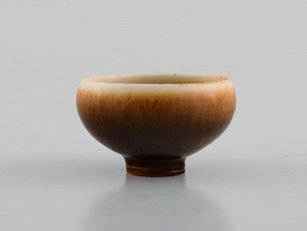Berndt Friberg (1899-1981) for Gustavsberg Studiohand. 
Miniature bowl in glazed ceramics. Beautiful glaze in light brown shades. 
1960s / 70s.
Measures: 42 x 25 mm.
In excellent condition.
Signed.