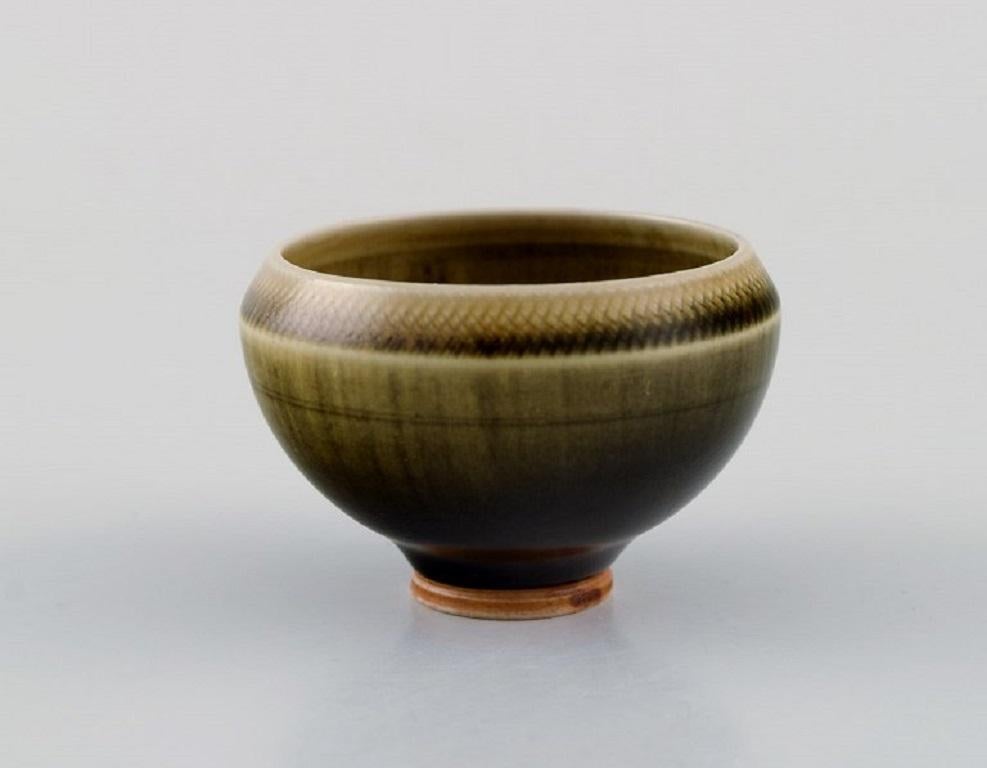 Berndt Friberg (1899-1981) for Gustavsberg Studiohand. 
Miniature bowl in glazed ceramics. Beautiful glaze in shades of green and light brown. 1960s / 70s.
Measures: 55 x 35 mm.
In excellent condition.
Signed.