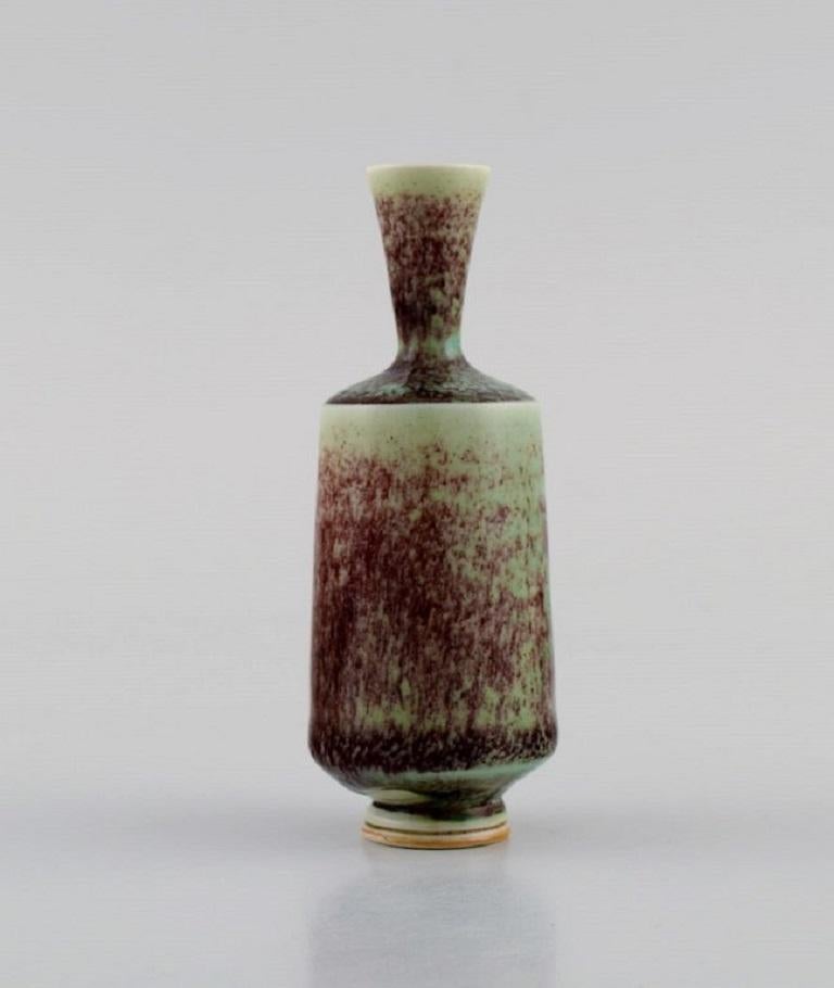 Berndt Friberg (1899-1981) for Gustavsberg Studio. 
Miniature vase in glazed ceramics. Beautiful glaze in shades of purple and turquoise. 1970s.
Measures: 8.8 x 3.5 cm.
In excellent condition.
Signed.