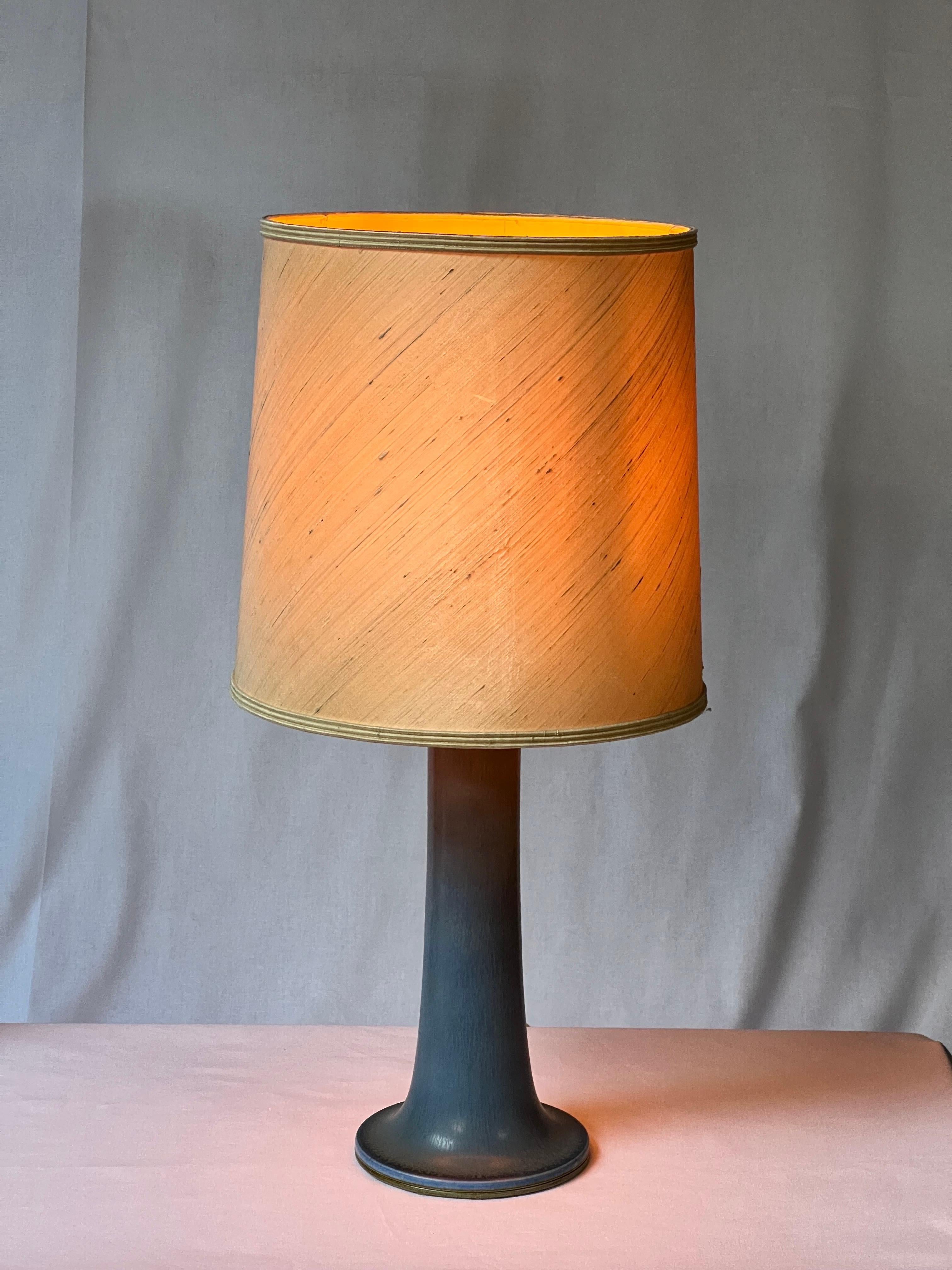 This is a very unique table lamp made by hand with a blue glaze. Impressive measurements. Lamps are very hard to find from this artist, a real must have. This is a real lamp not a vase that was transformed later. You can see the glaze around the