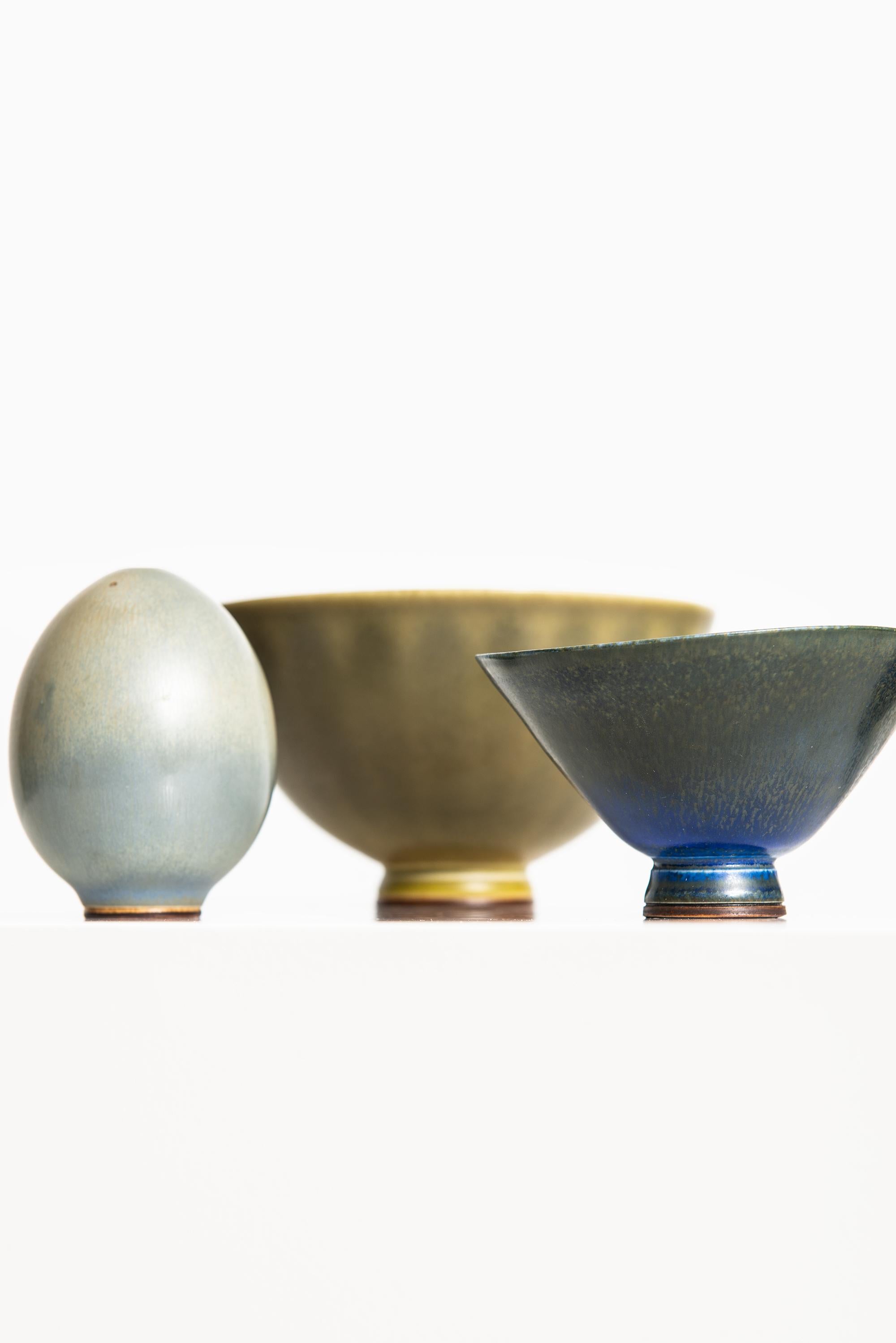Rare set of 5 small ceramic vases designed by Berndt Friberg. Produced by Gustavsberg in Sweden.