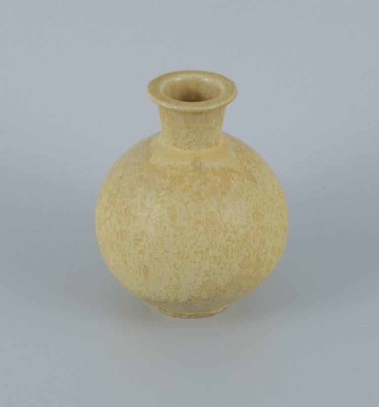 Berndt Friberg for Gustavsberg.
Ceramic vase with speckled yellow glaze.
1960s.
Perfect condition.
First factory quality.
Indistinctly stamped.
Dimensions: H 10.5 x D 8.0 cm.