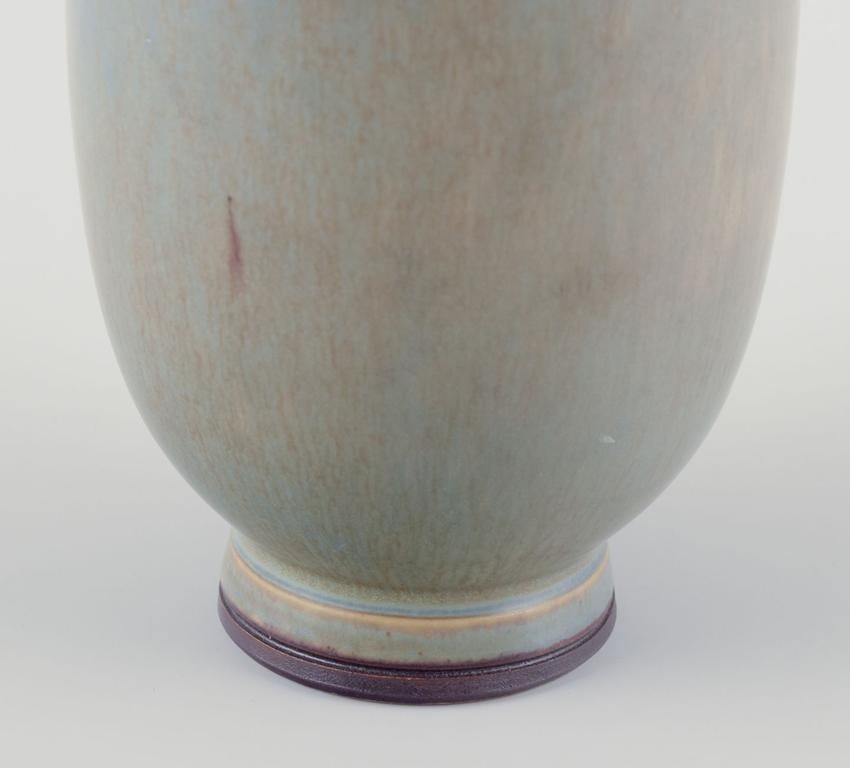 PRE-OWNED GOODS ARE EXEMPT FROM IMPORT TARIFFS FOR U.S., UK, AUSTRALIAN & CANADIAN CUSTOMERS.   
THEREFORE, NO IMPORT TARIFFS WILL BE APPLICABLE TO YOUR PURCHASE. 

Berndt Friberg for Gustavsberg Studio, Sweden.
Large slender ceramic vase.
Narrow