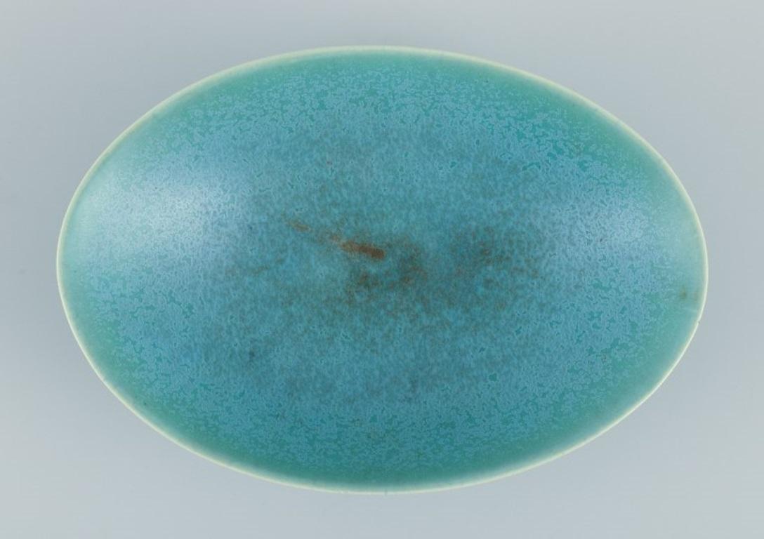 Scandinavian Modern Berndt Friberg for Gustavsberg, Sweden. Oval ceramic bowl in eggshell glaze