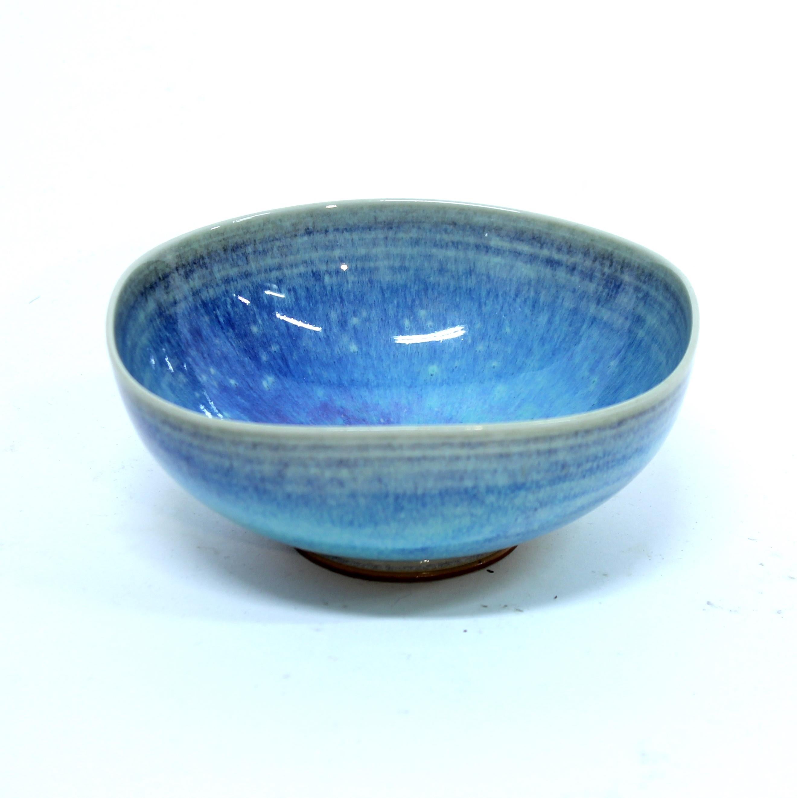 Light blue Aniara bowl designed by Berndt Friberg for Gustavsberg in the 1950s. The colour has a large mix of blue hues and subtle patterns. Very good vintage condition with minimal ware.