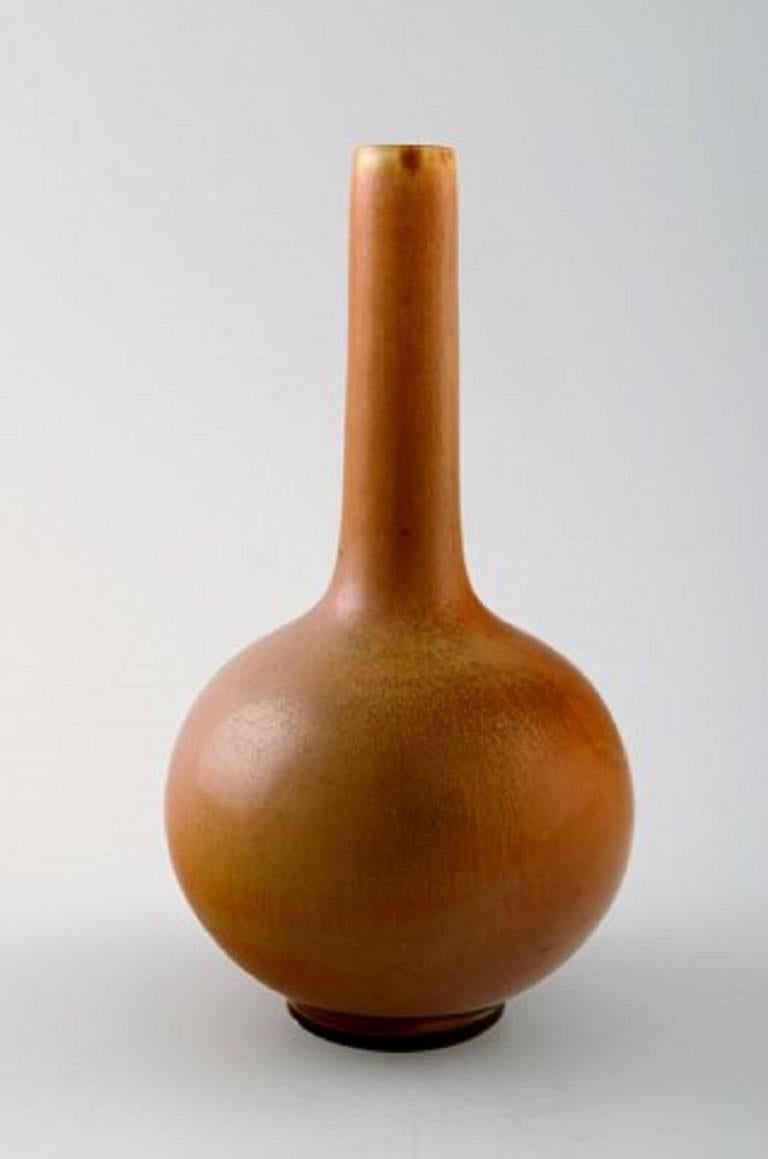Berndt Friberg Studio ceramic vase. Modern Swedish design. Unique, handmade.
Beautiful glaze in brown shades.
Perfect condition. 1st. factory quality.
Measures: 14 x 8 cm.